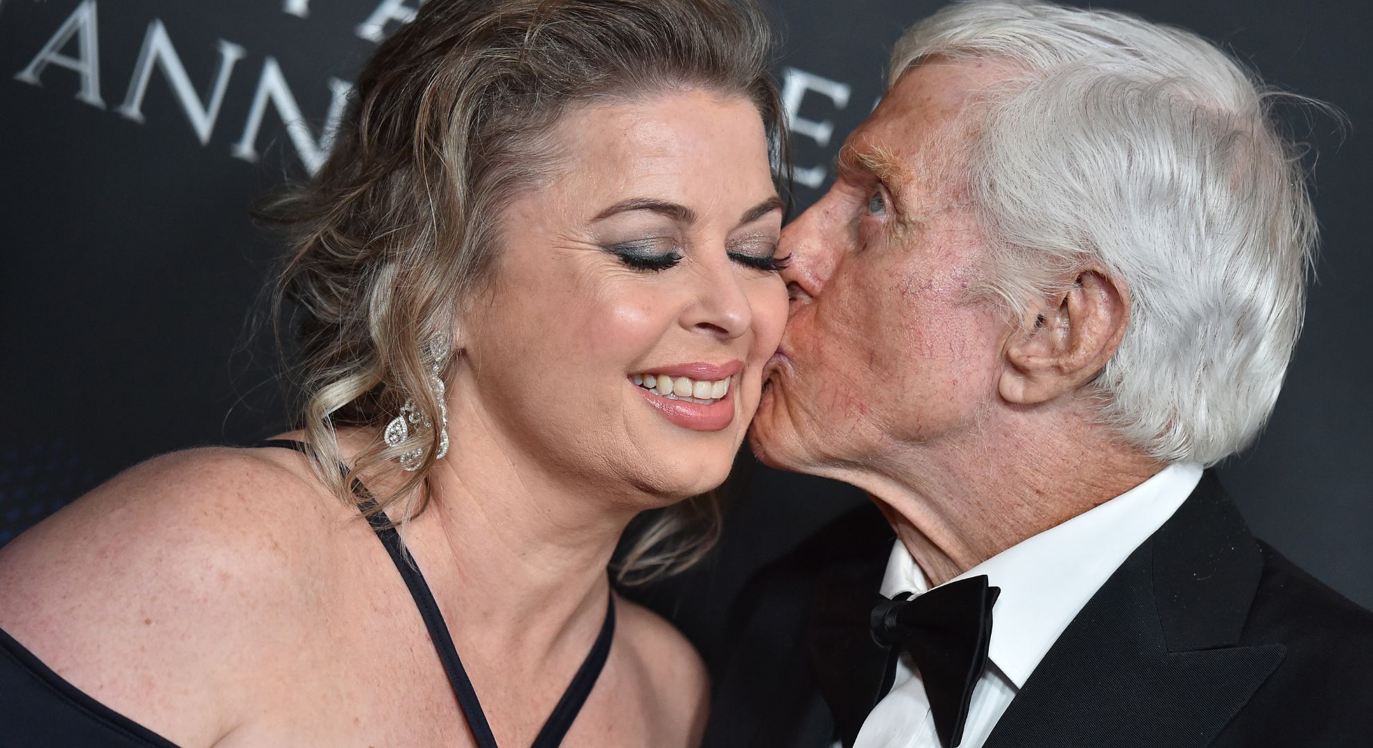 Dick Van Dyke kissing his wife Arlene Silver on the cheek