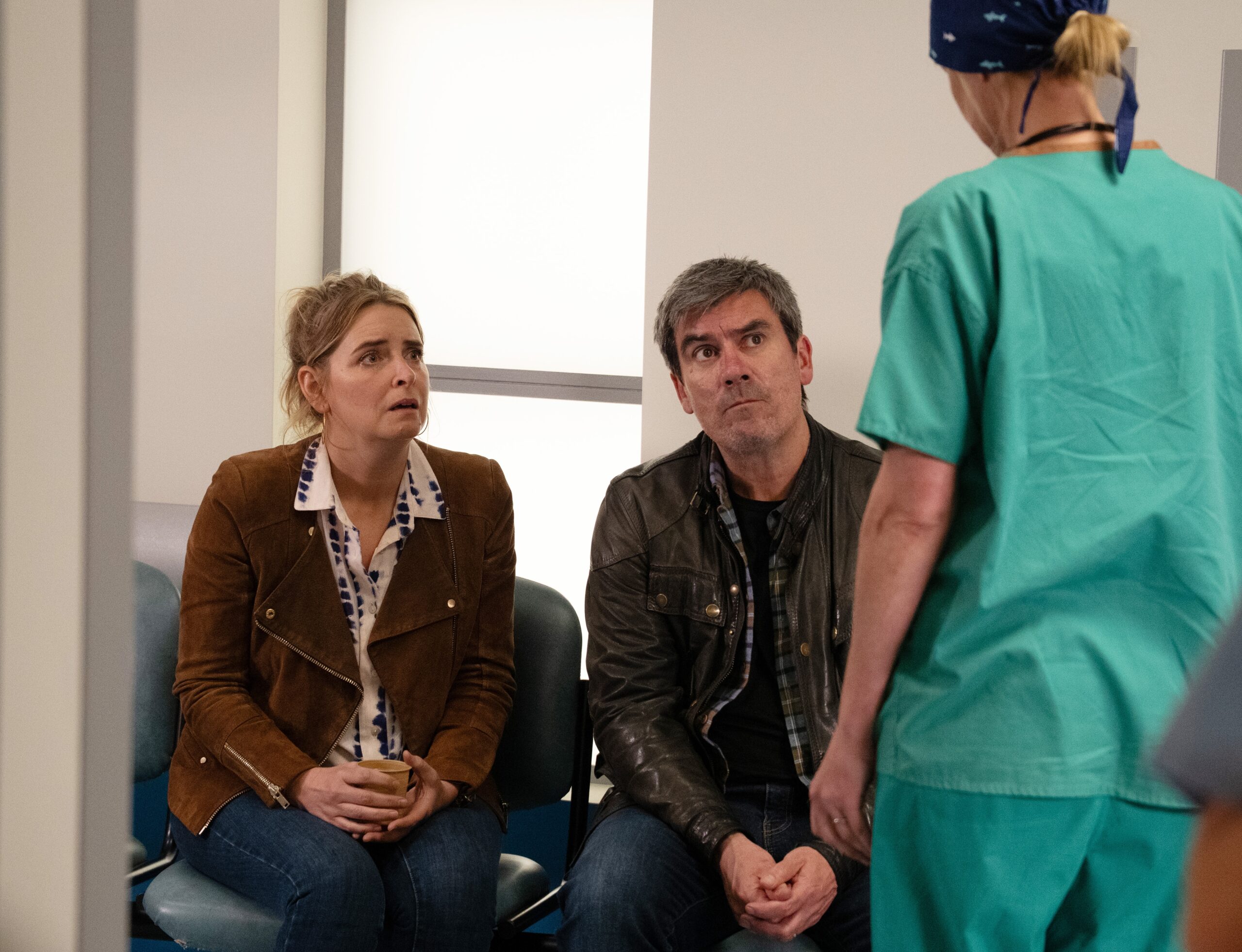 Sarah and Cain talking to the surgeon in Emmerdale