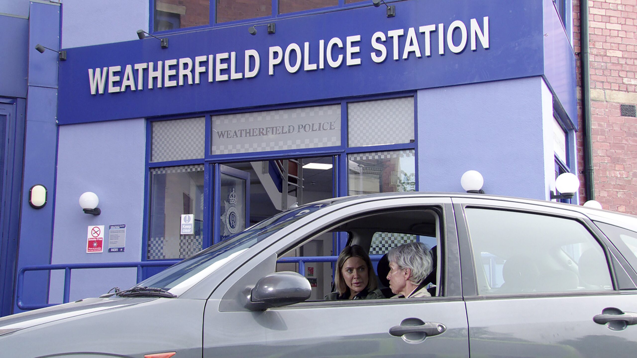 Debbie and Abi in car outside police station