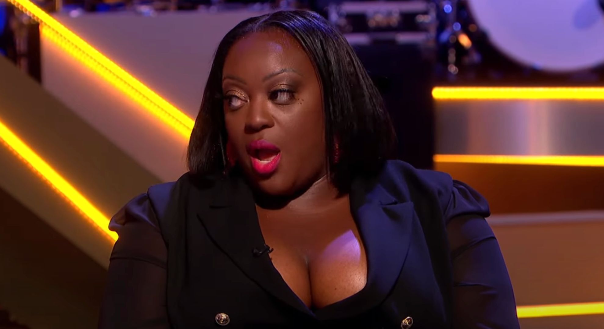 Judi Love speaking on a chat show