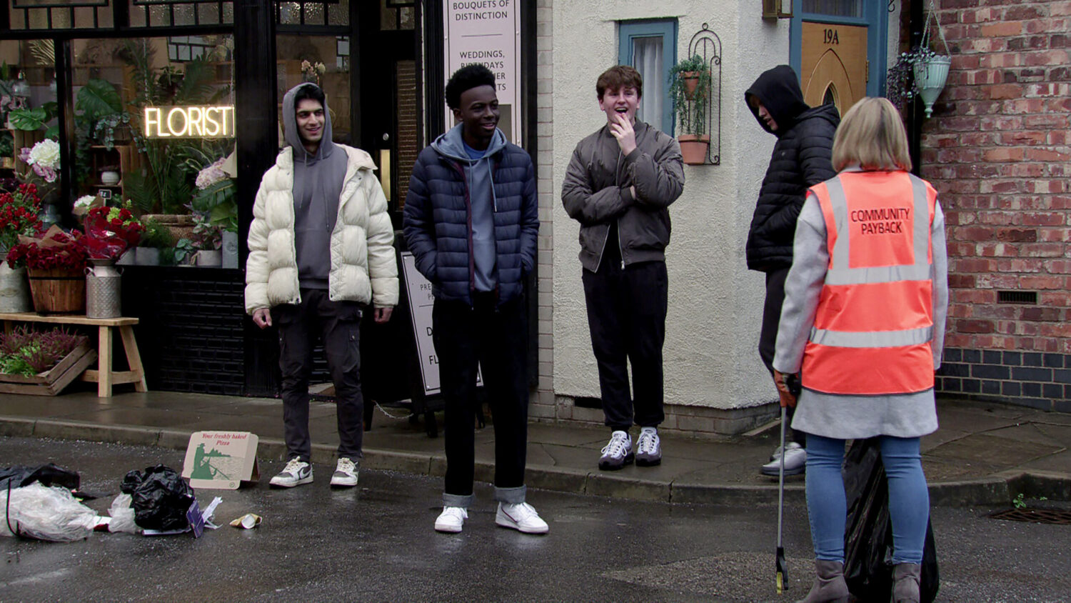 Teenagers laughing at Leanne wearing high-vis