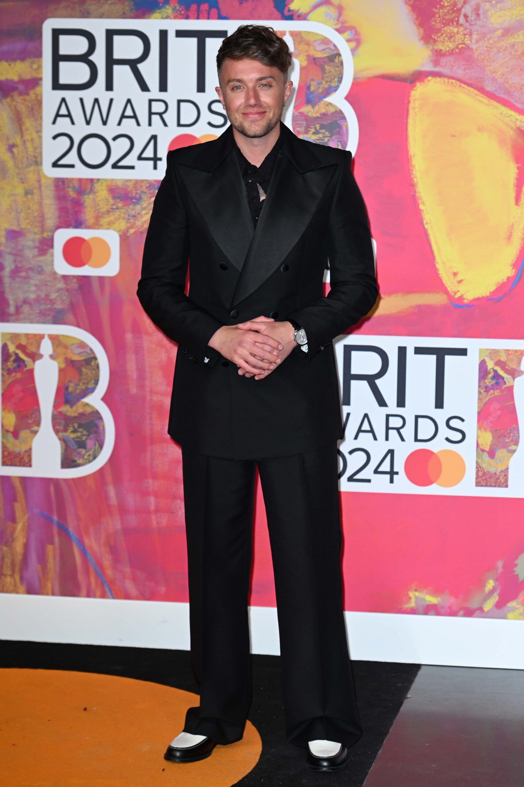 Roman Kemp posing on the red carpet at the BRITS 