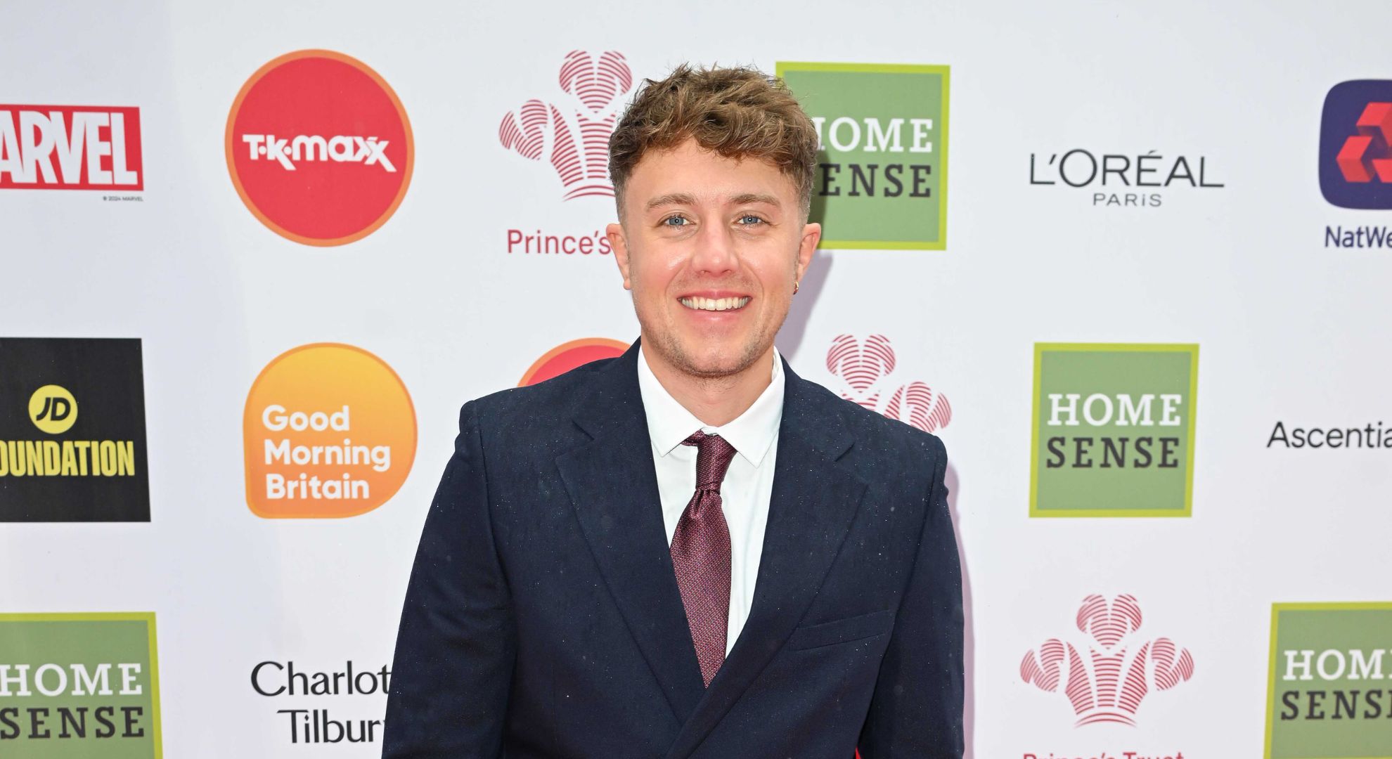 Roman Kemp smiling on the red carpet 