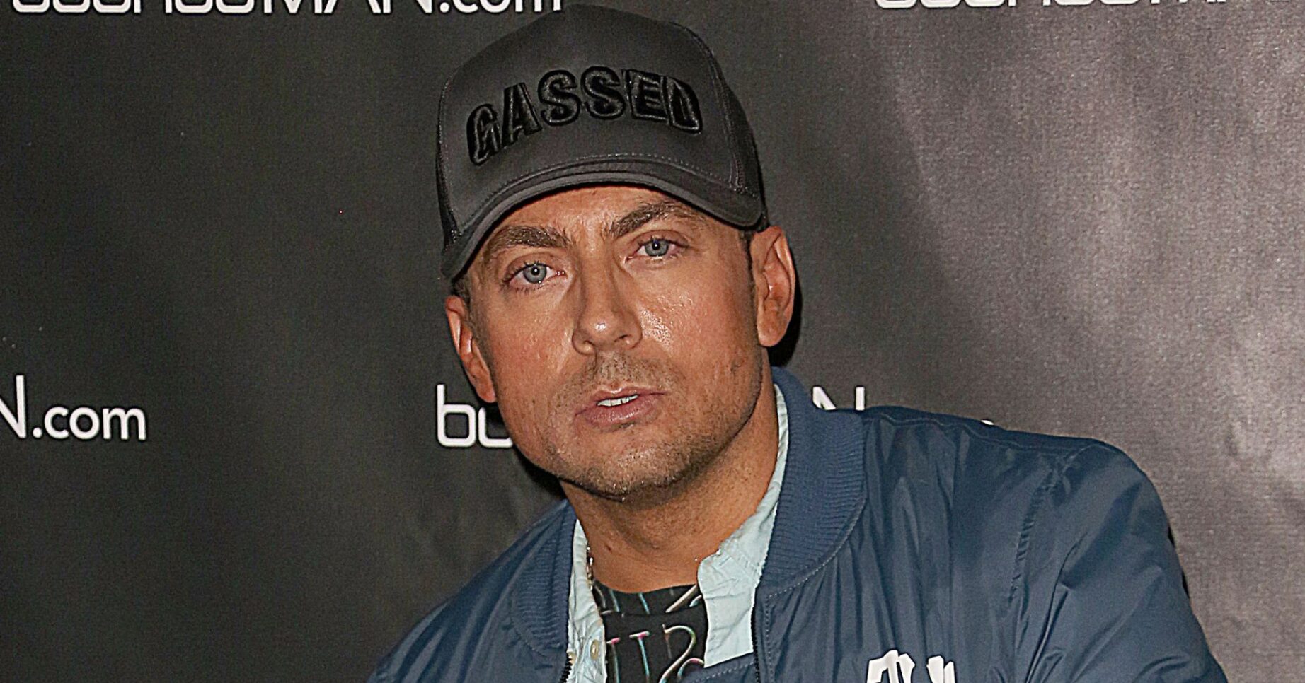 Paul Danan wearing a cap
