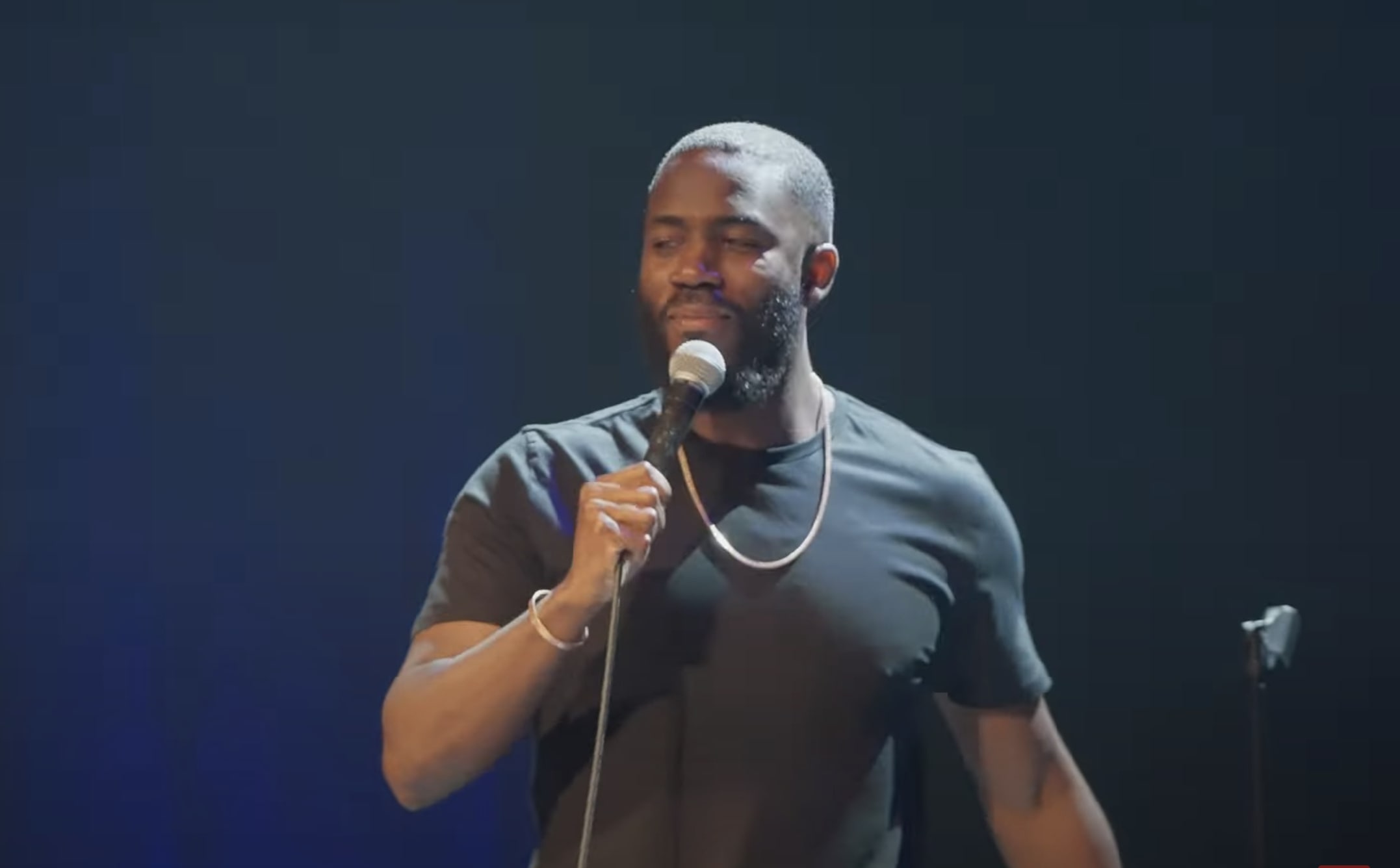 Mo Gilligan performing on stage