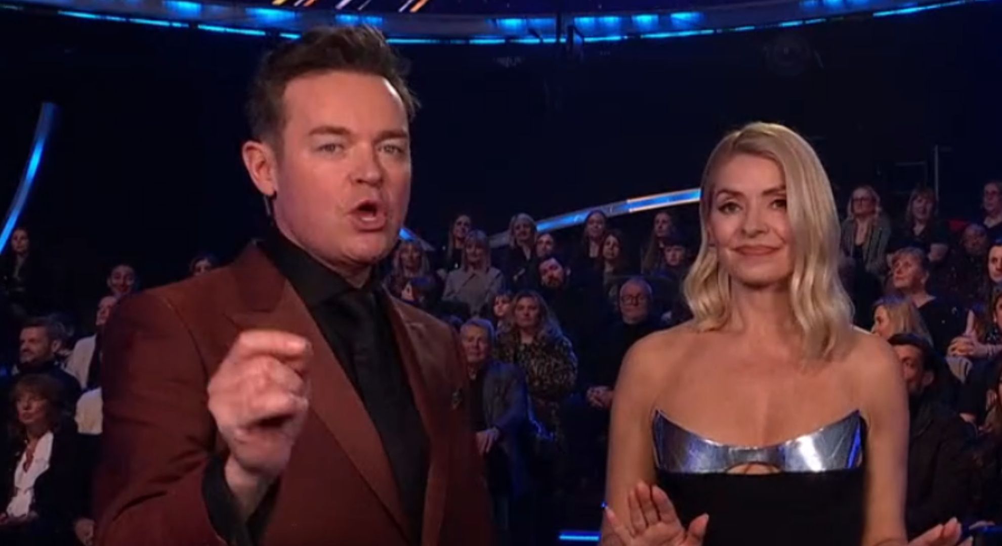 Screenshot of Dancing On Ice showing Stephen Mulhern and Holly Willoughby standing side by side 