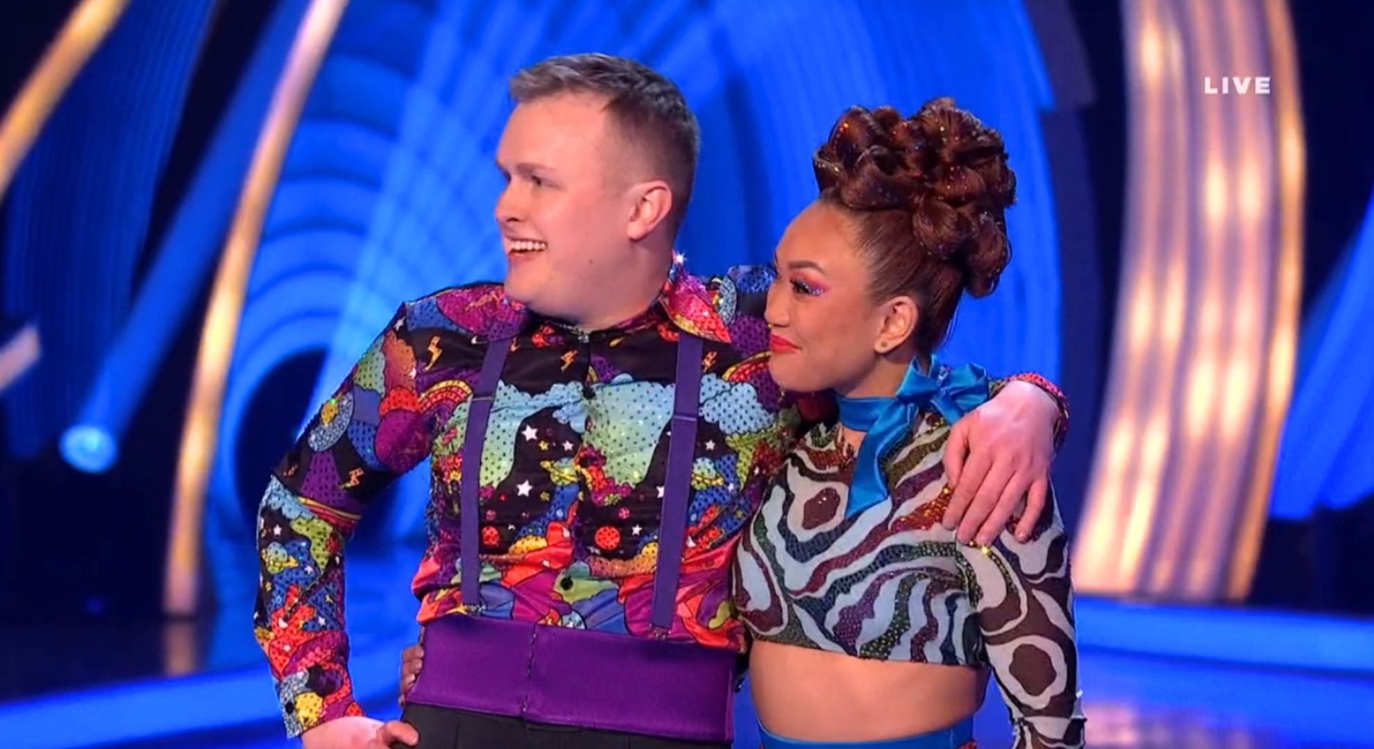 Josh Jones and his dancing partner Tippy Packard looking away