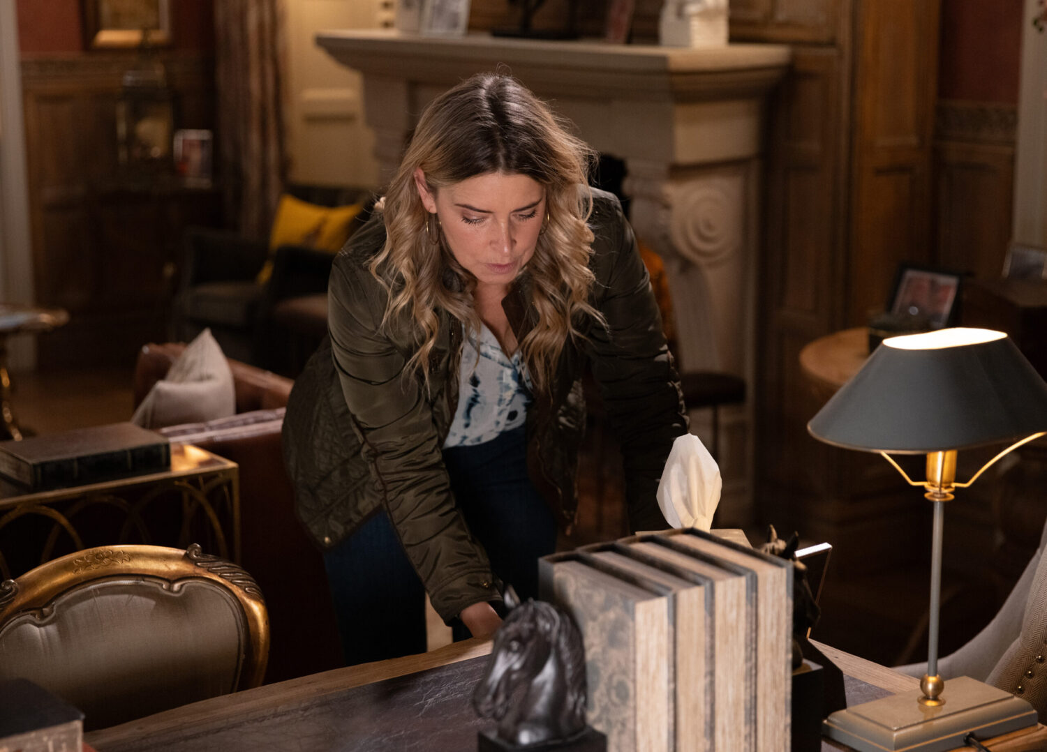 Charity sneaking into Home Farm on Emmerdale