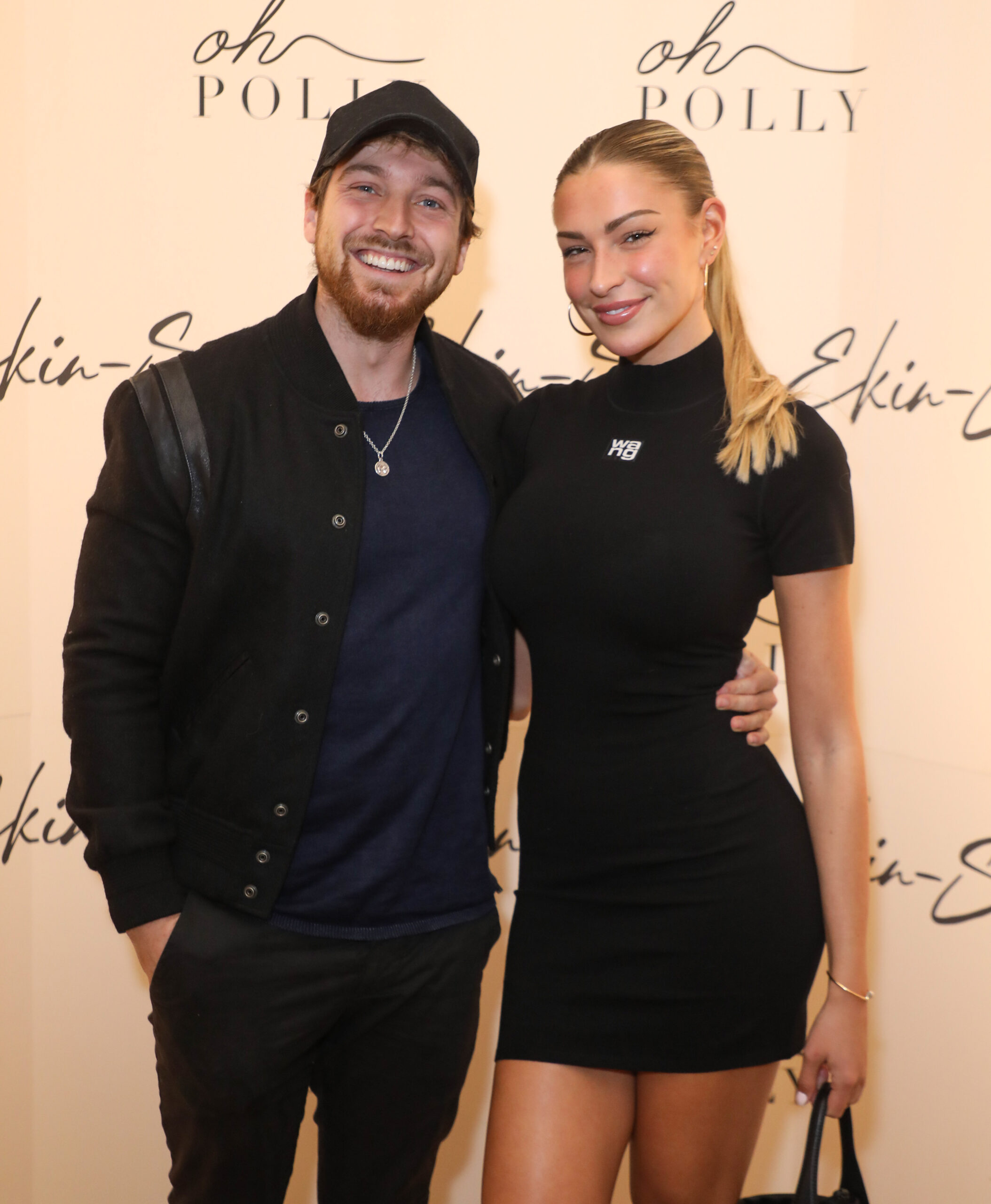 Sam Thompson and Zara McDermott looking at the camera