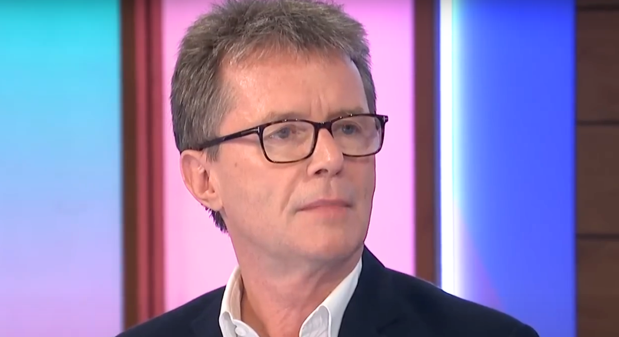 Nicky Campbell looking to his left