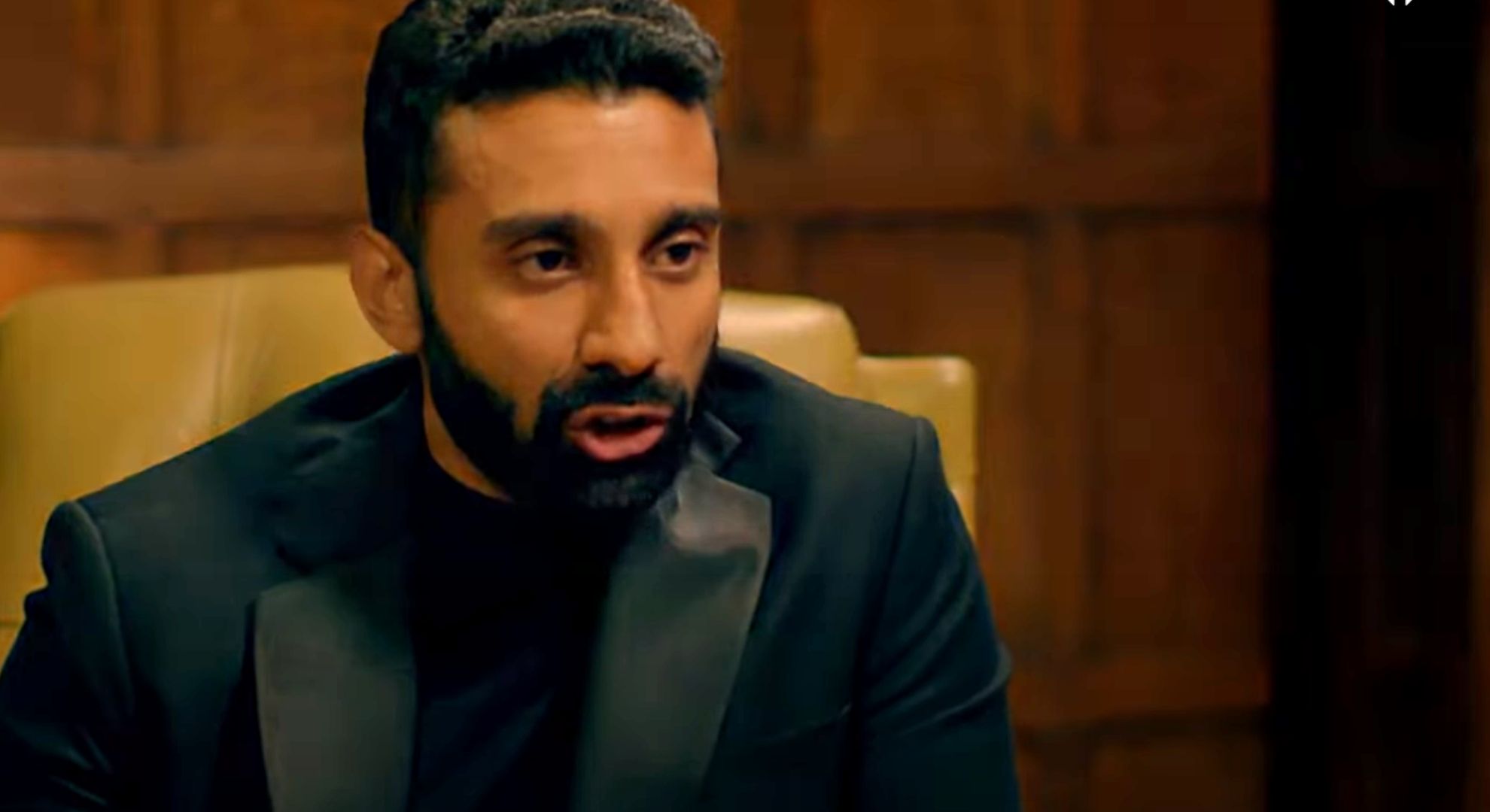 Jaz Singh from Traitors looking to his left