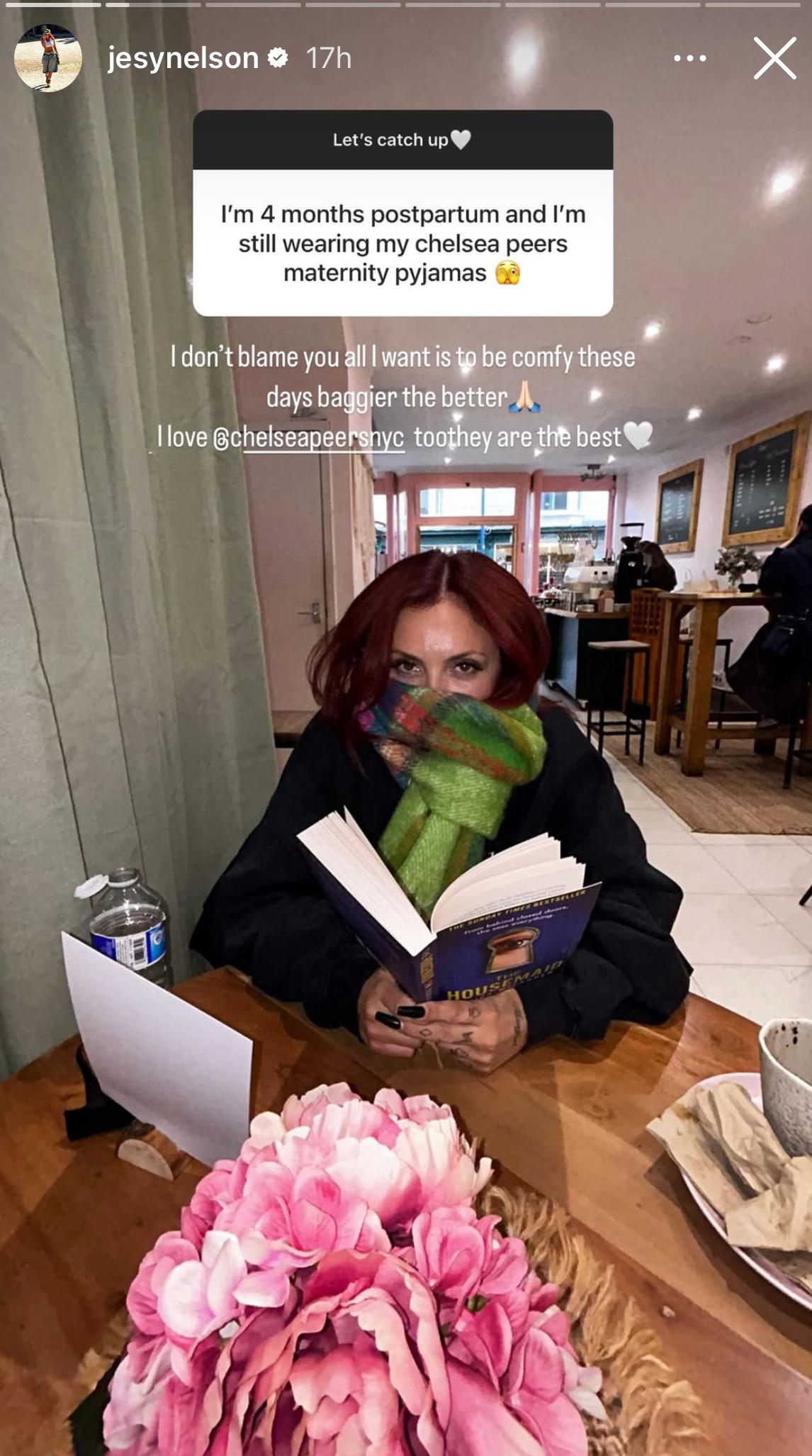 Jesy Nelson wearing a scarf in a cafe
