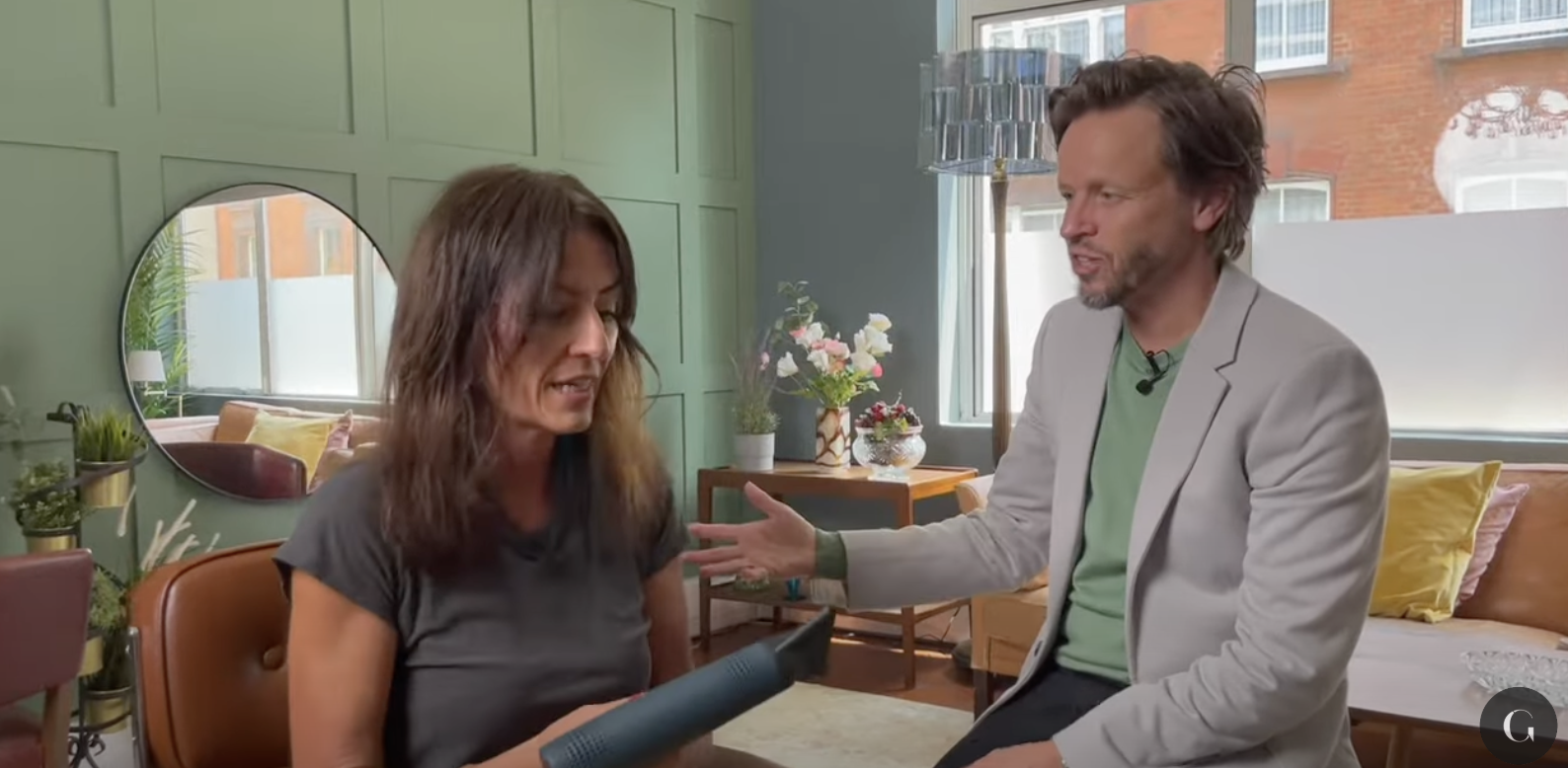 Davina McCall and Michael Douglas styling each others hair