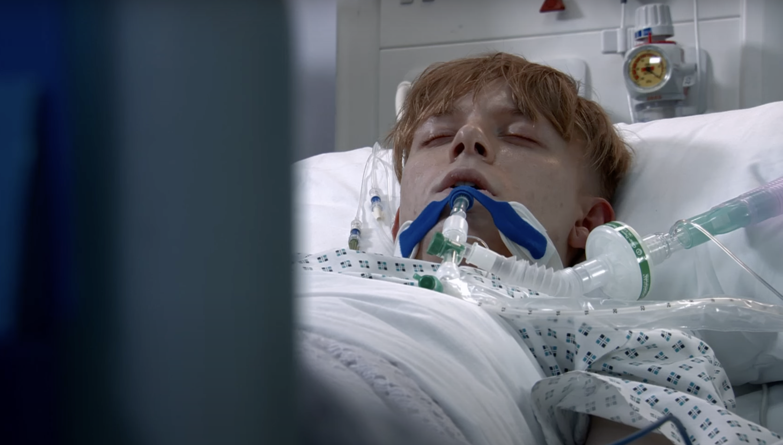 Max lying in hospital bed in Coronation Street