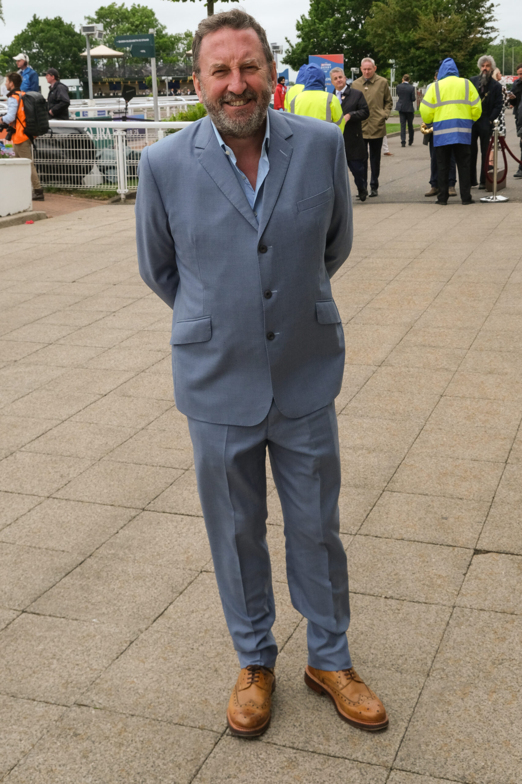 Lee Mack in a suit at 2024 Betfred Derby Festival - Ladies Day