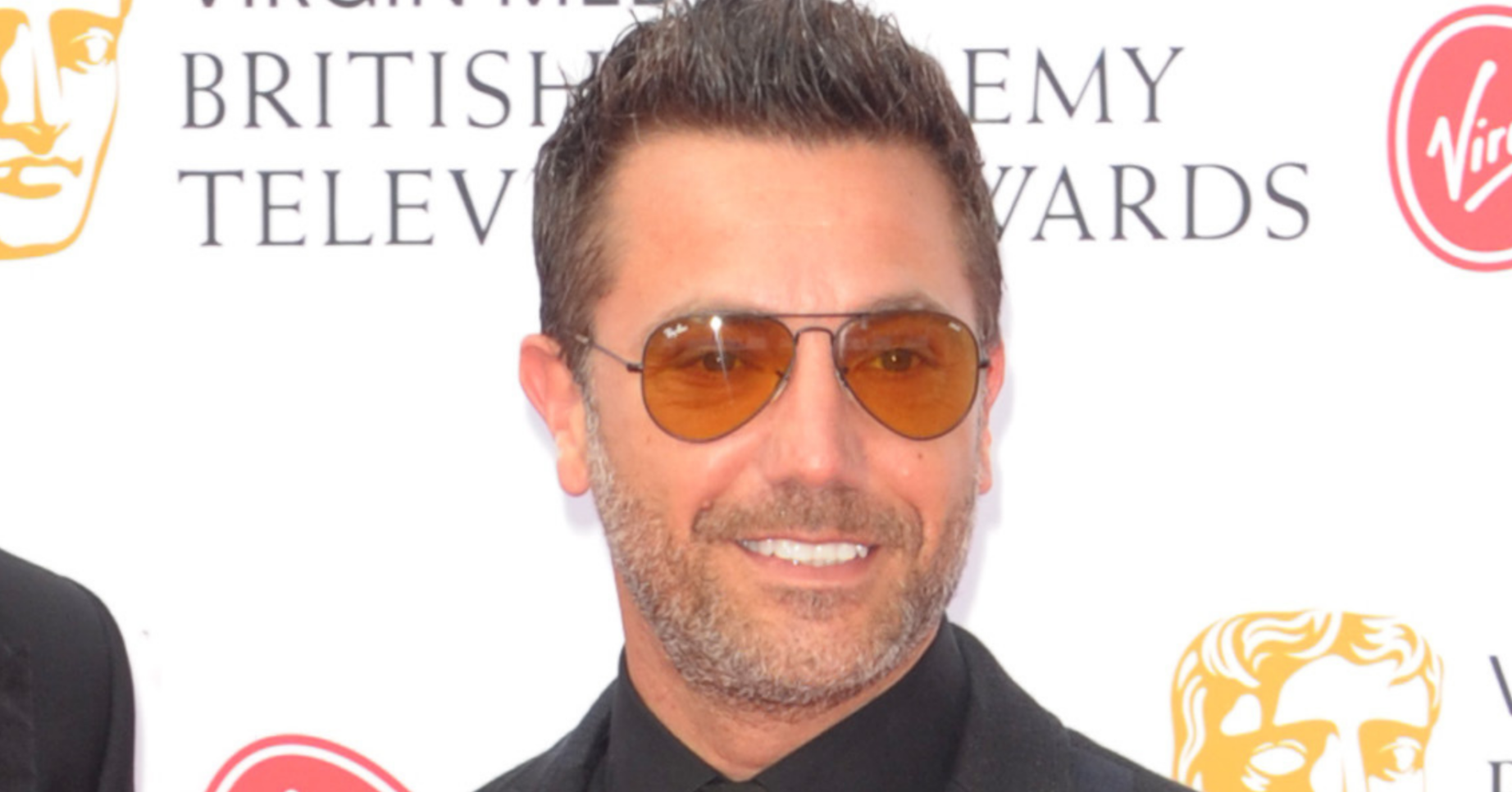 Gino D'Acampo smiling in sunglasses