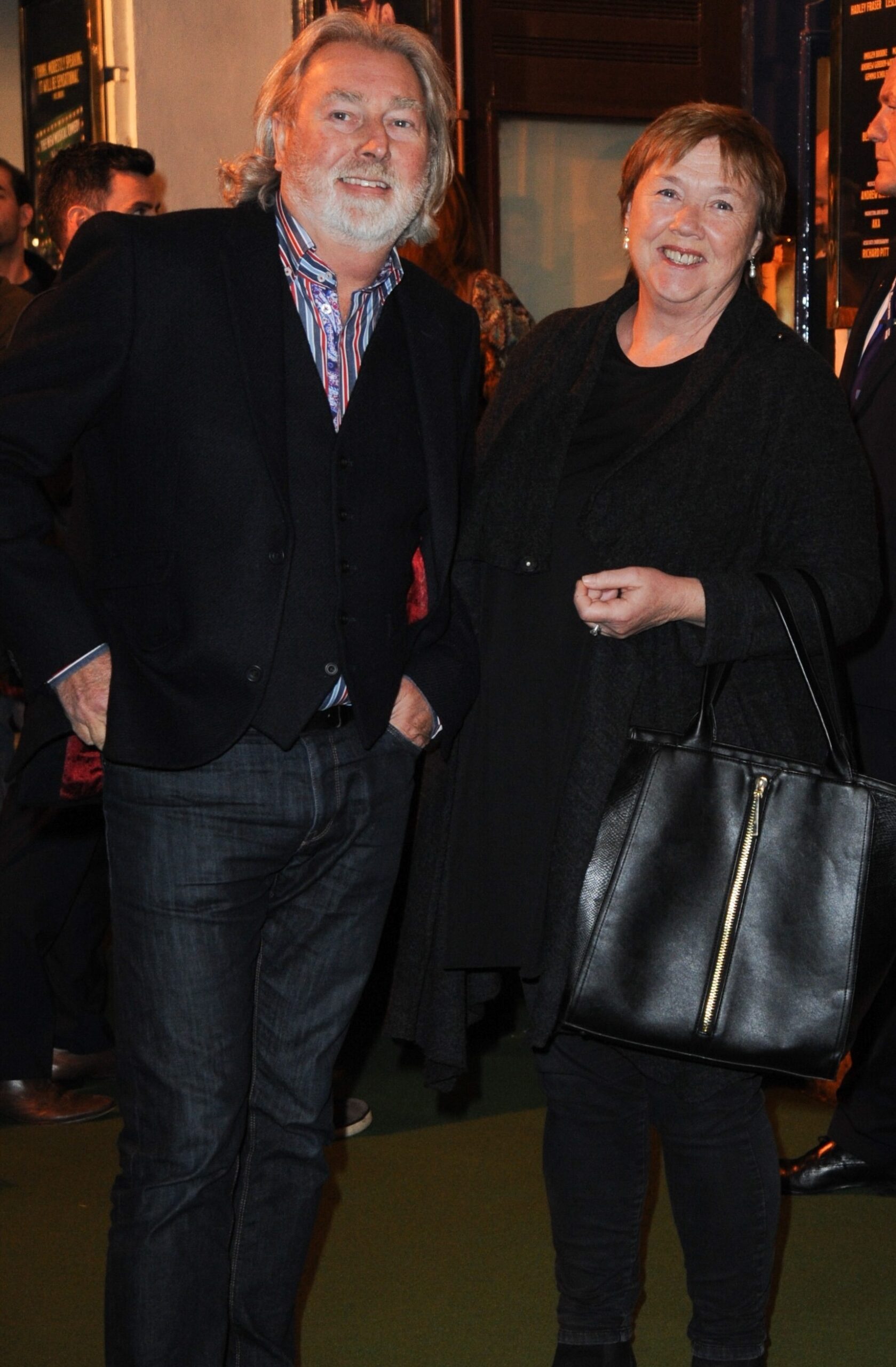 Pauline Quirke smiling with her husband on a night out