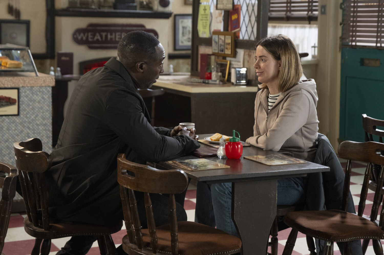 Ronnie and Abi talking to each other at Roy's