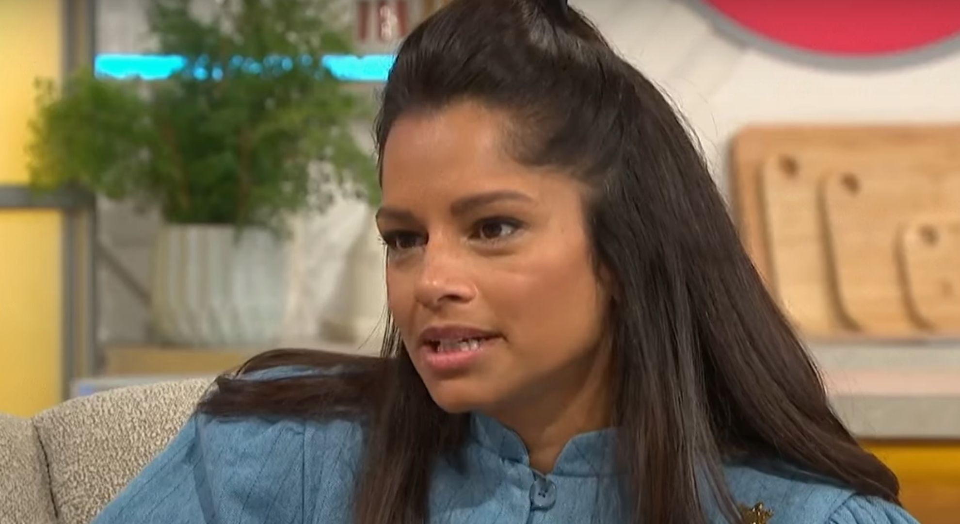 Dilly Carter looking to her right