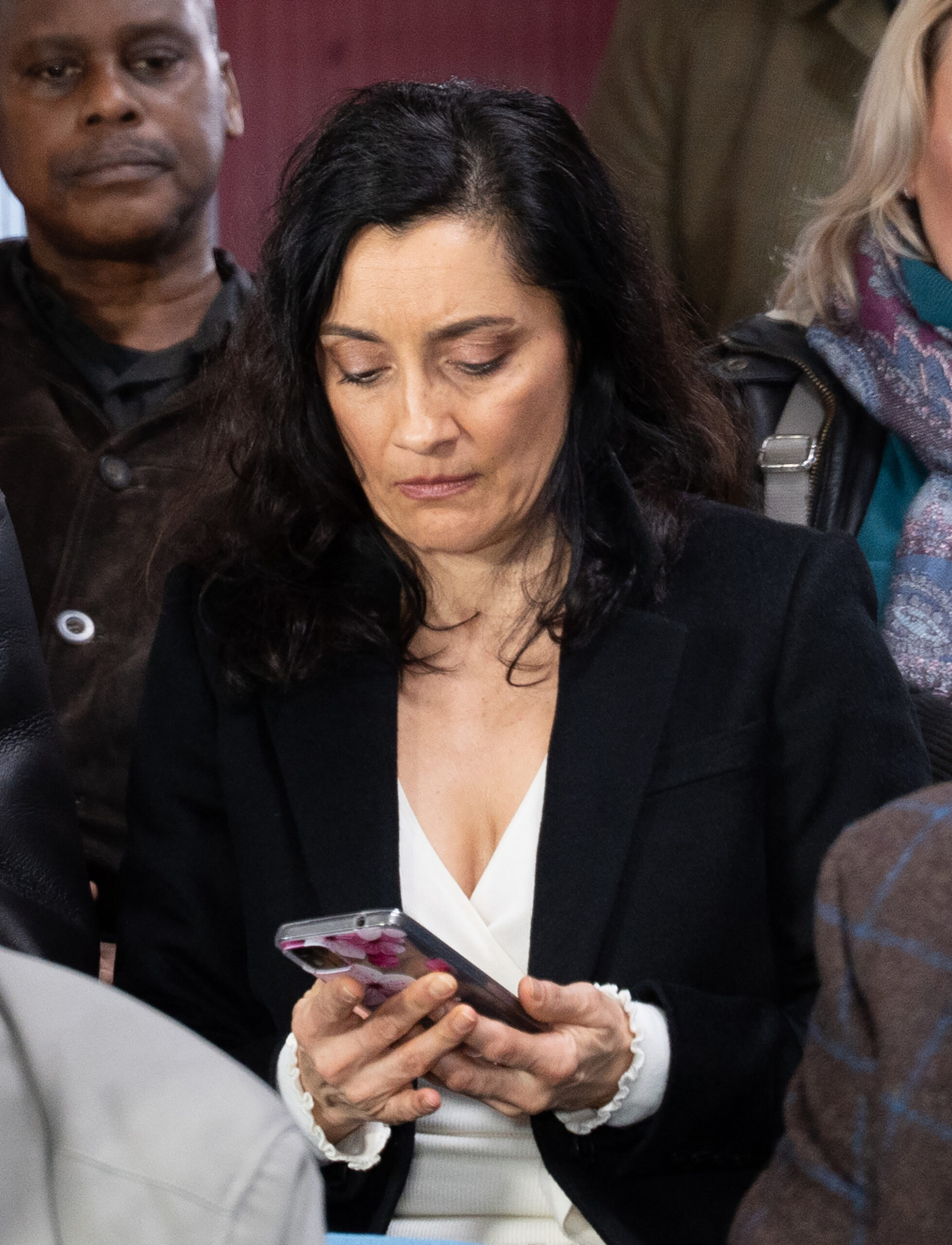 Manpreet looking at phone seriously