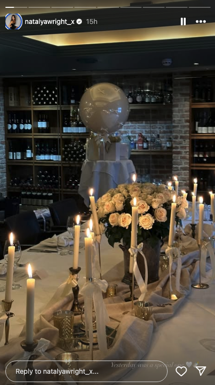 a long table, set with beautiful candles and flowers.