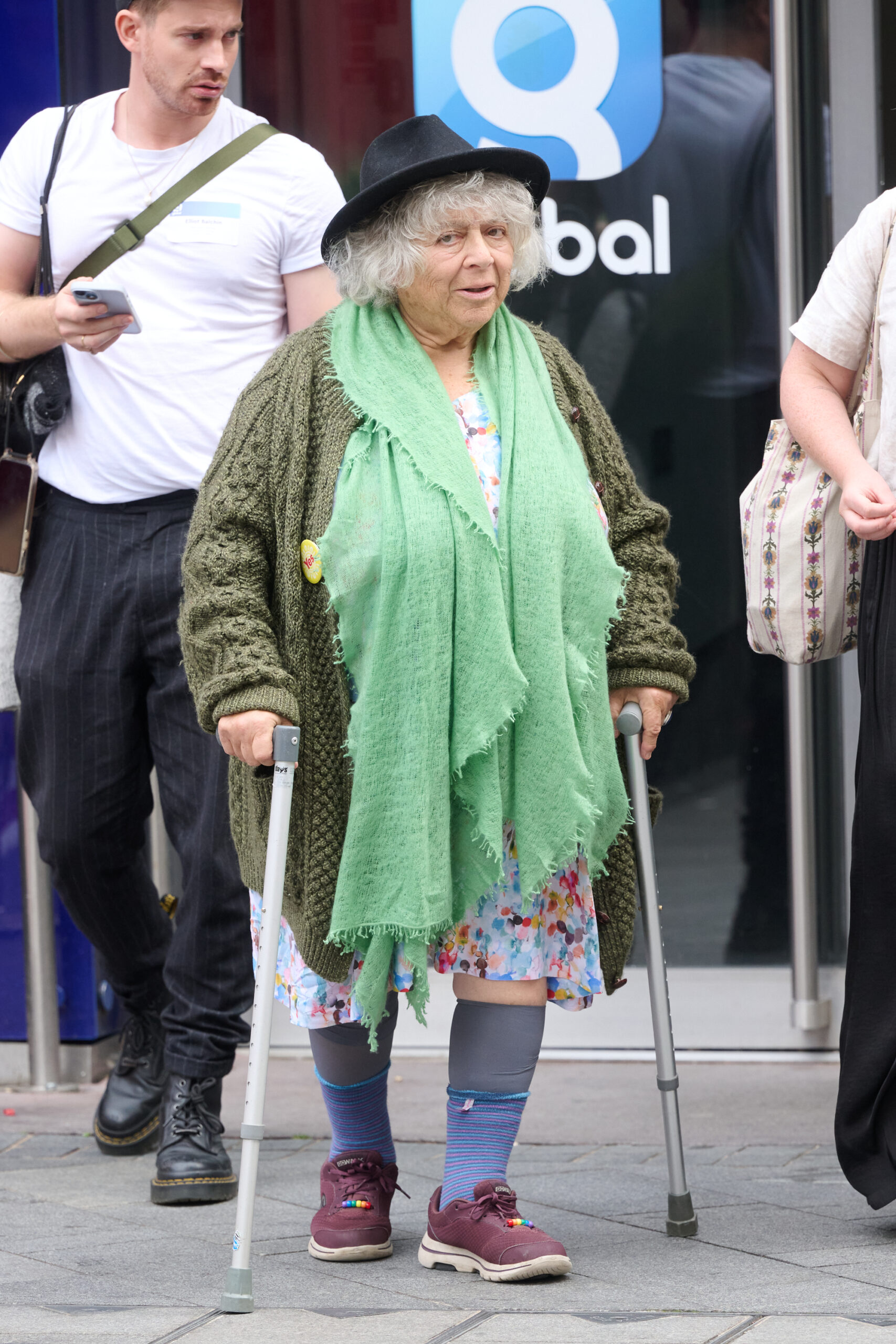 Miriam Margolyes walking with a stick