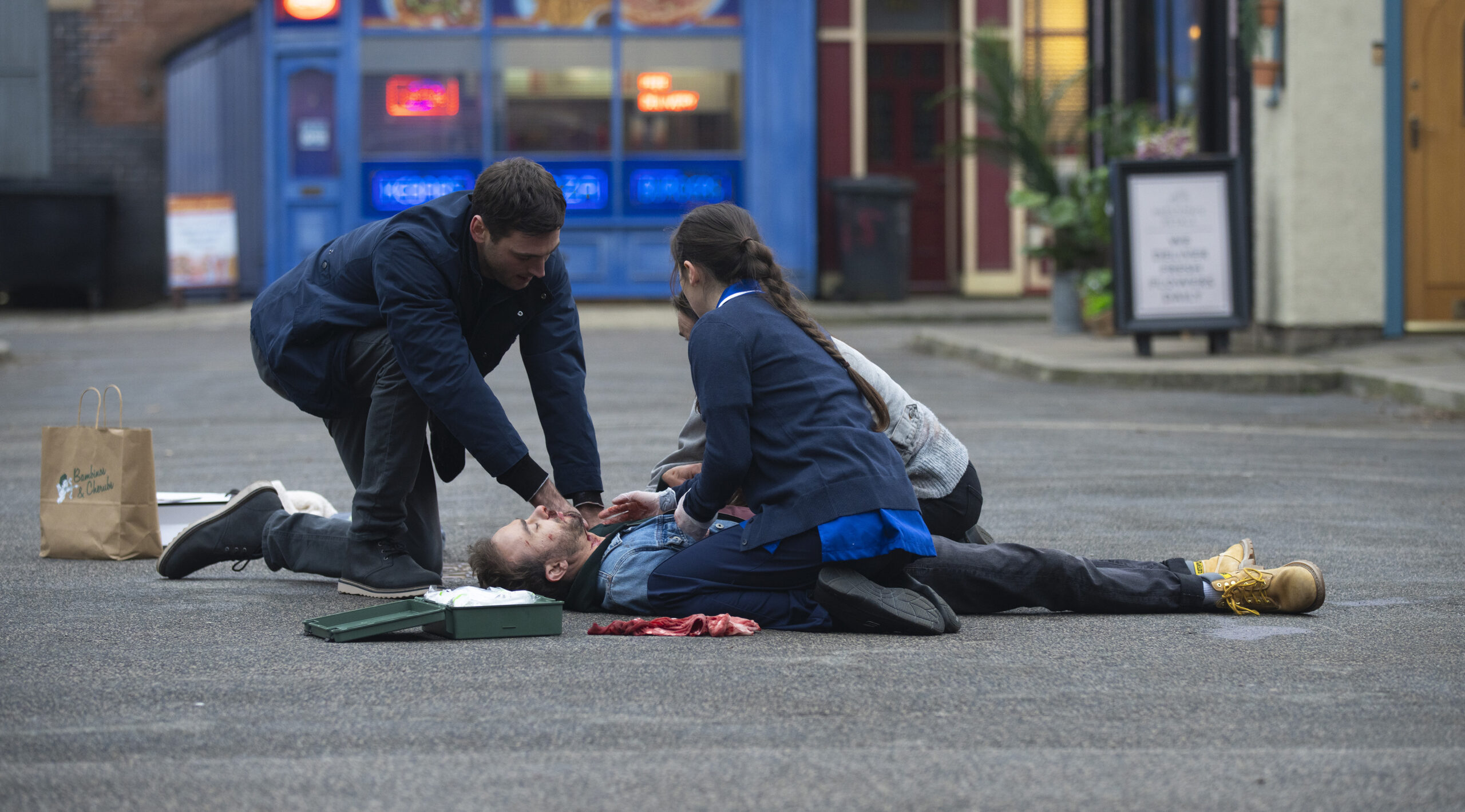 David lies bleeding in the road as Shona and Kit try to save his life