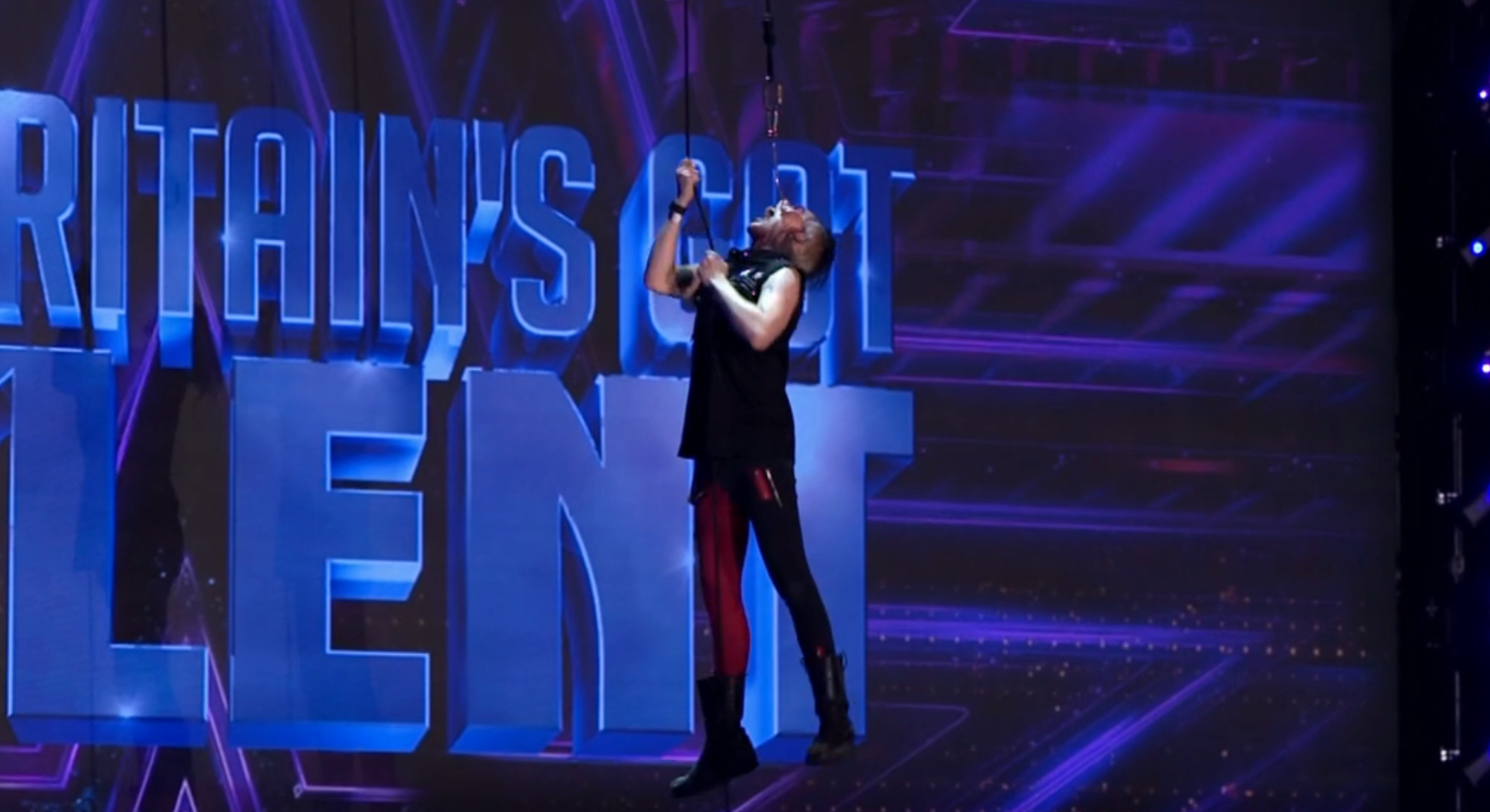 Auzy Blood hanging from the ceiling on BGT