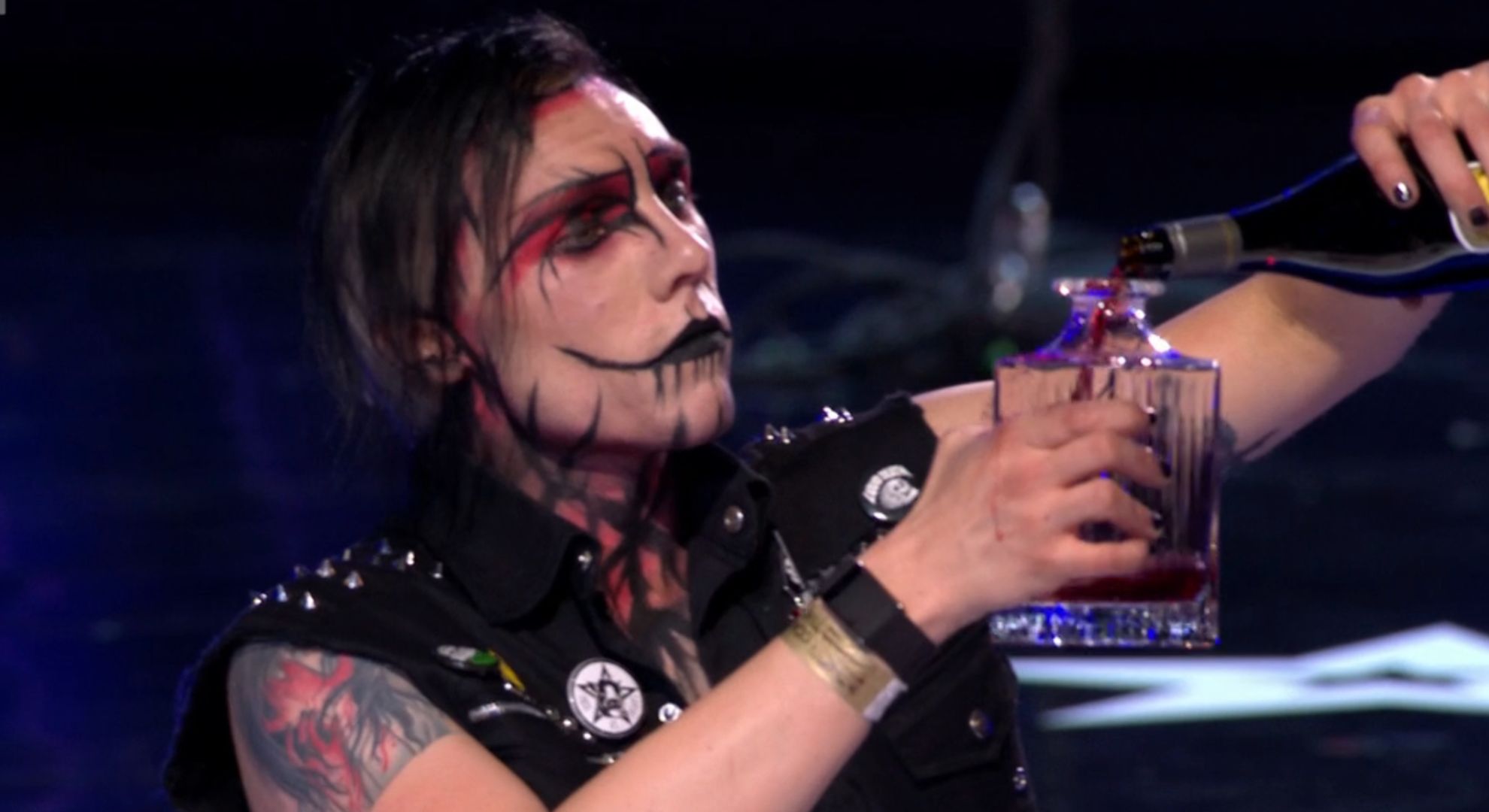 Auzy Blood pouring a bottle of wine