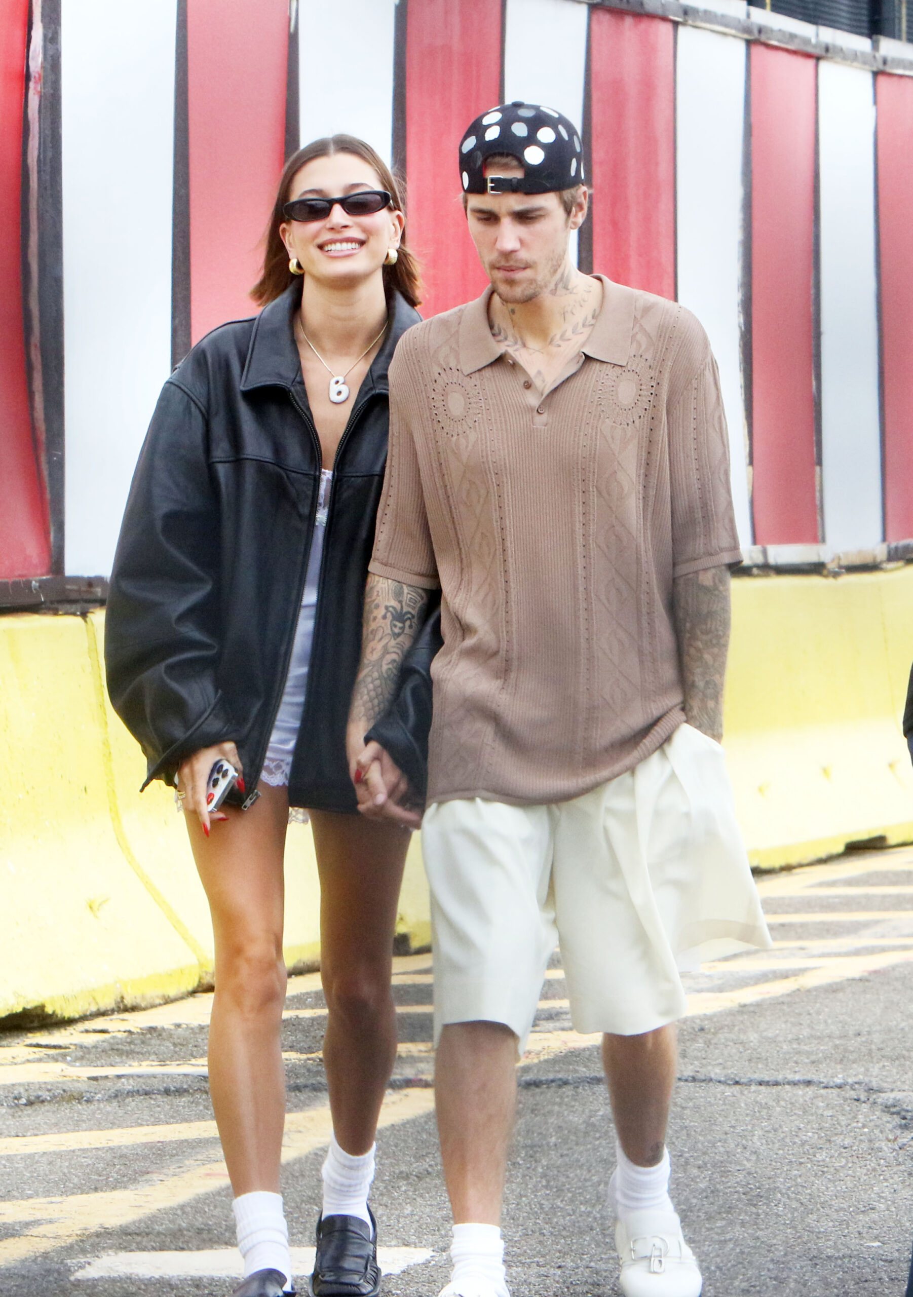 Hailey Bieber and Justin Bieber walking down the street 