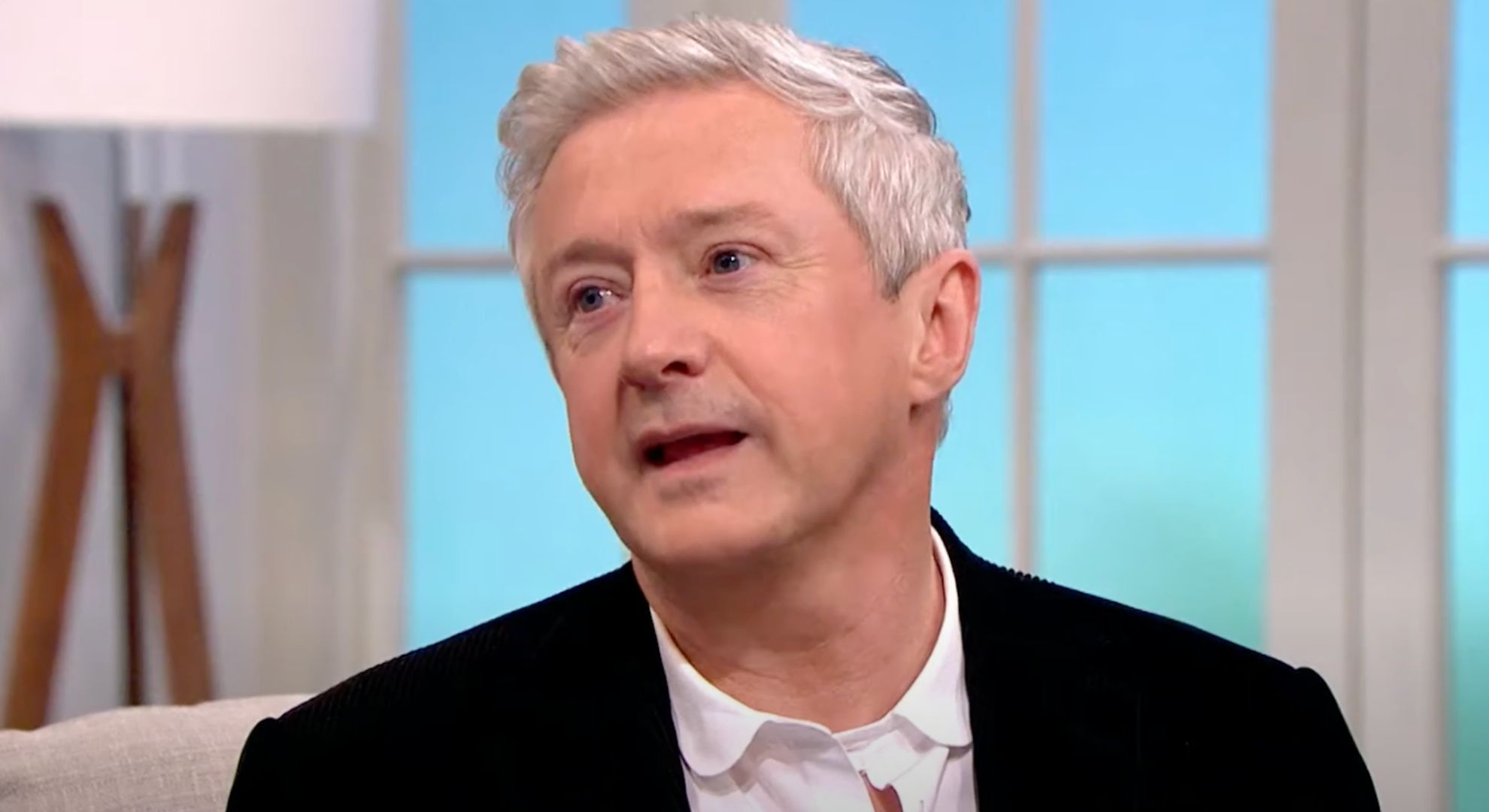 Louis Walsh wears a white shirt and a black blazer