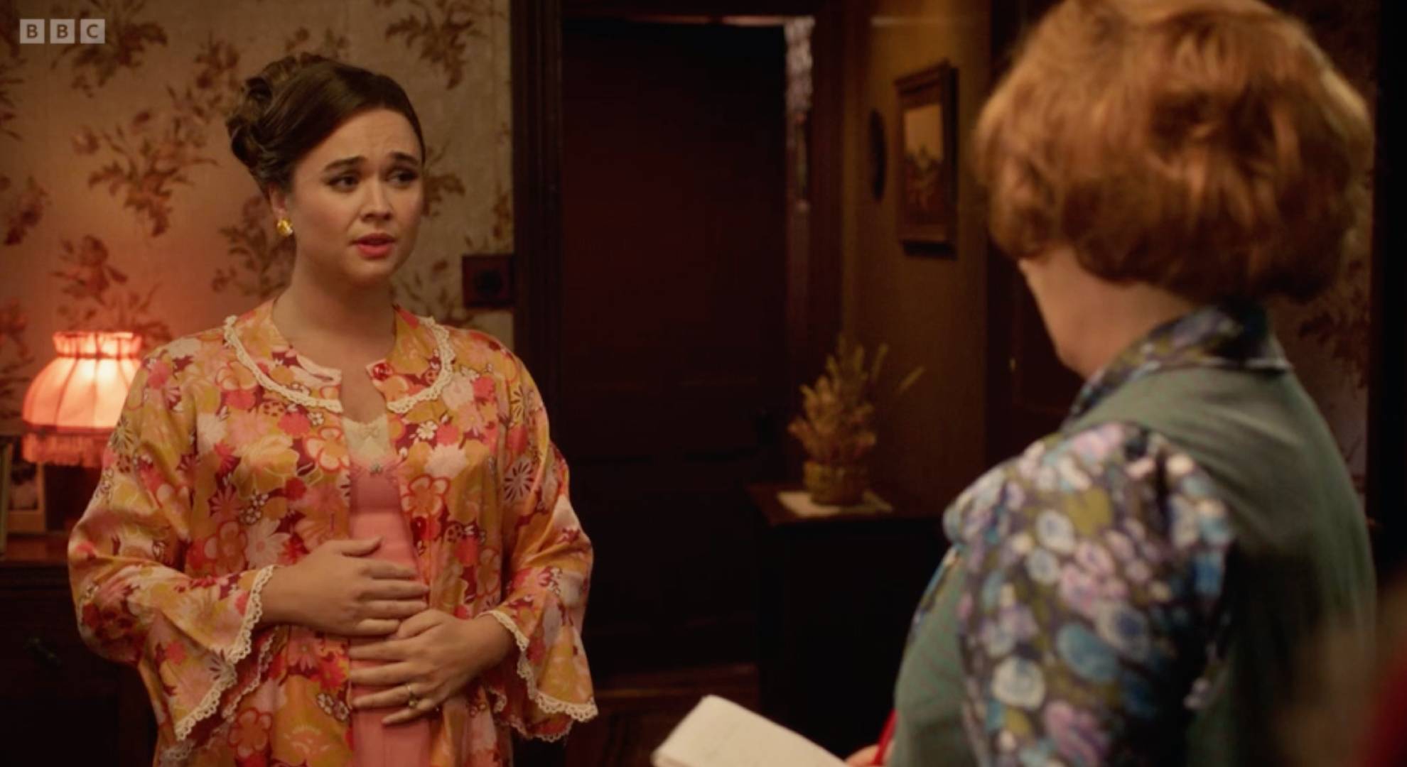 Nancy holds her stomach