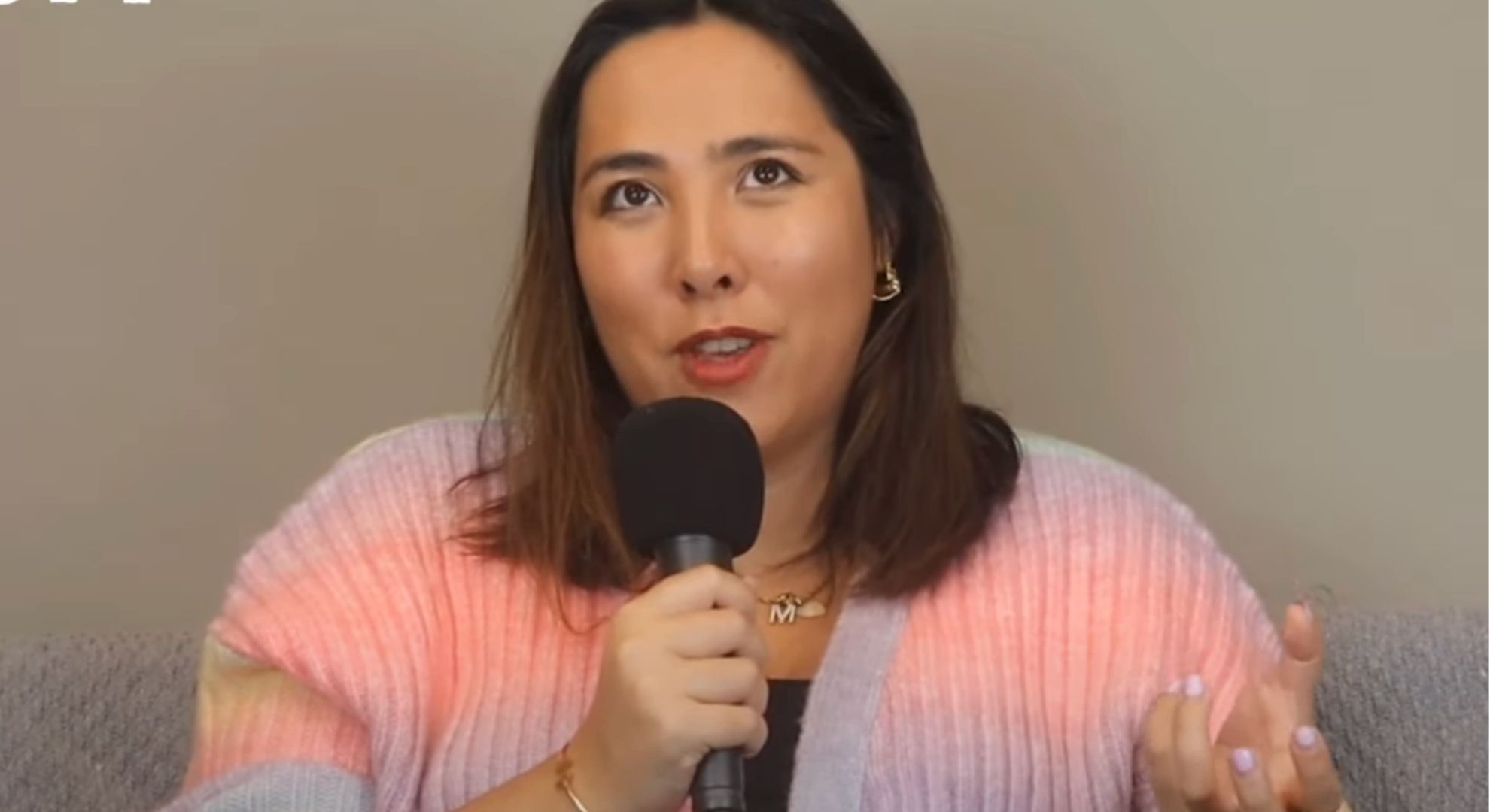 Michelle Elman speaking in a podcast