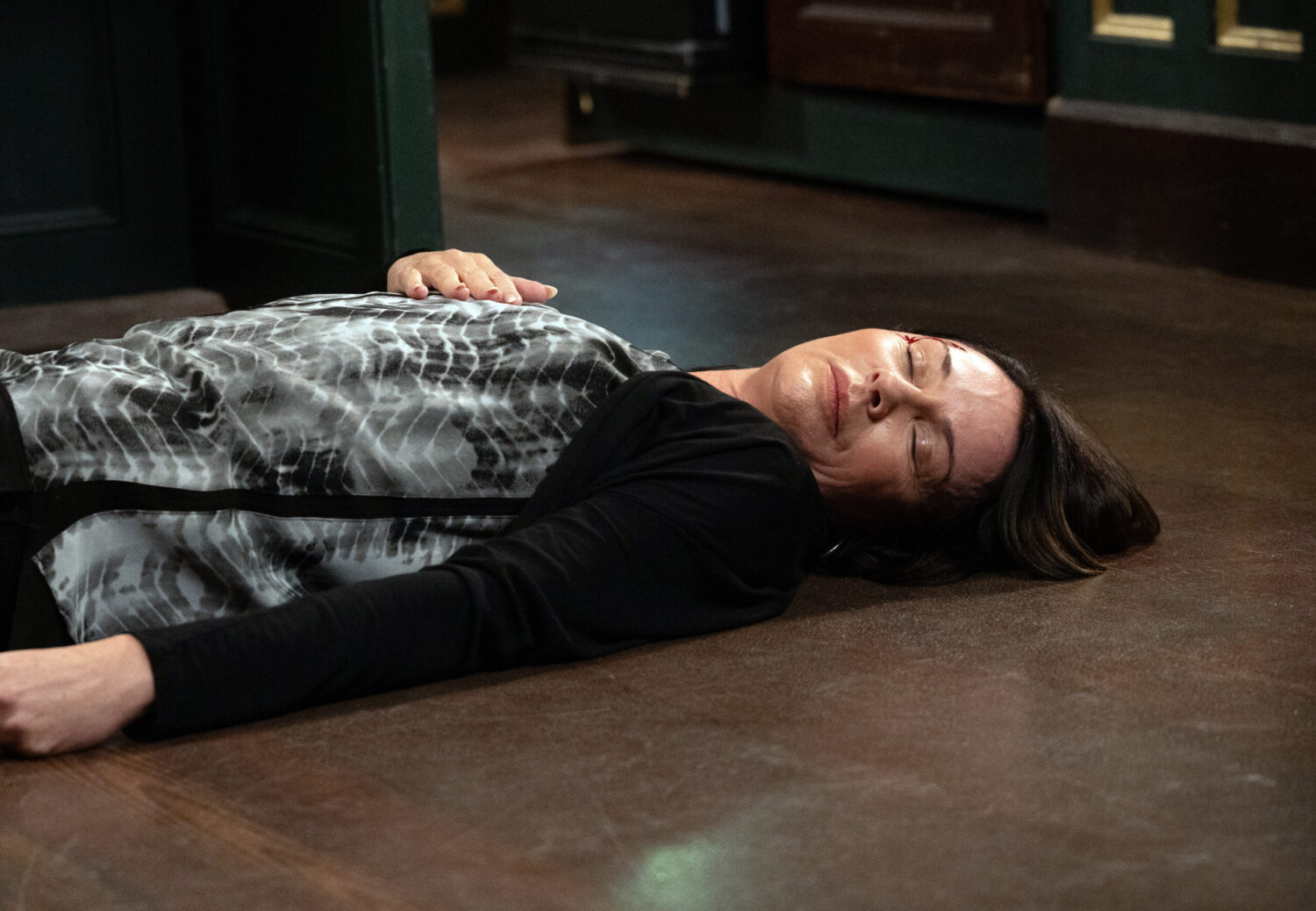 Chas unconscious on floor with cut on face