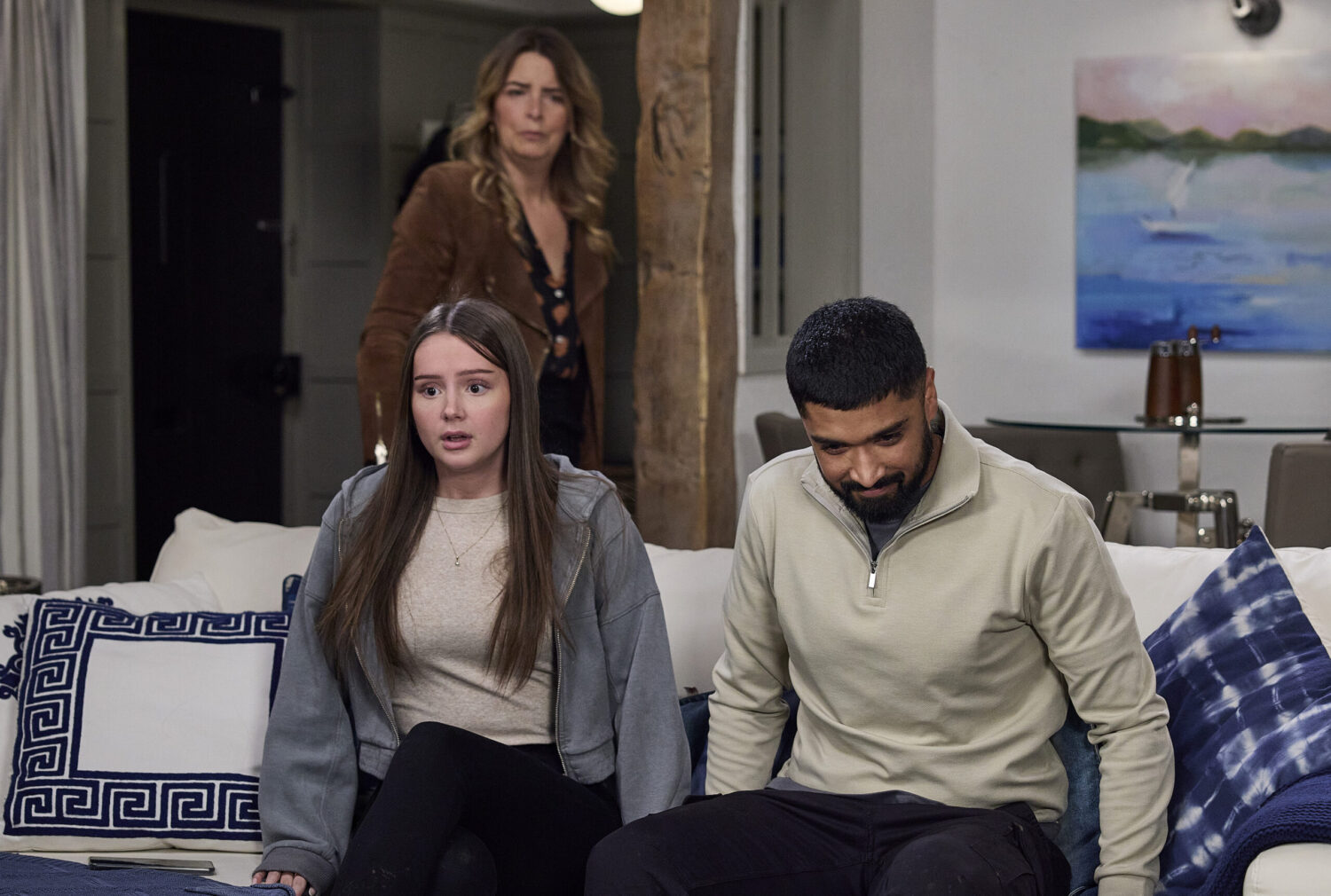 Charity standing behind shocked Sarah and Kammy