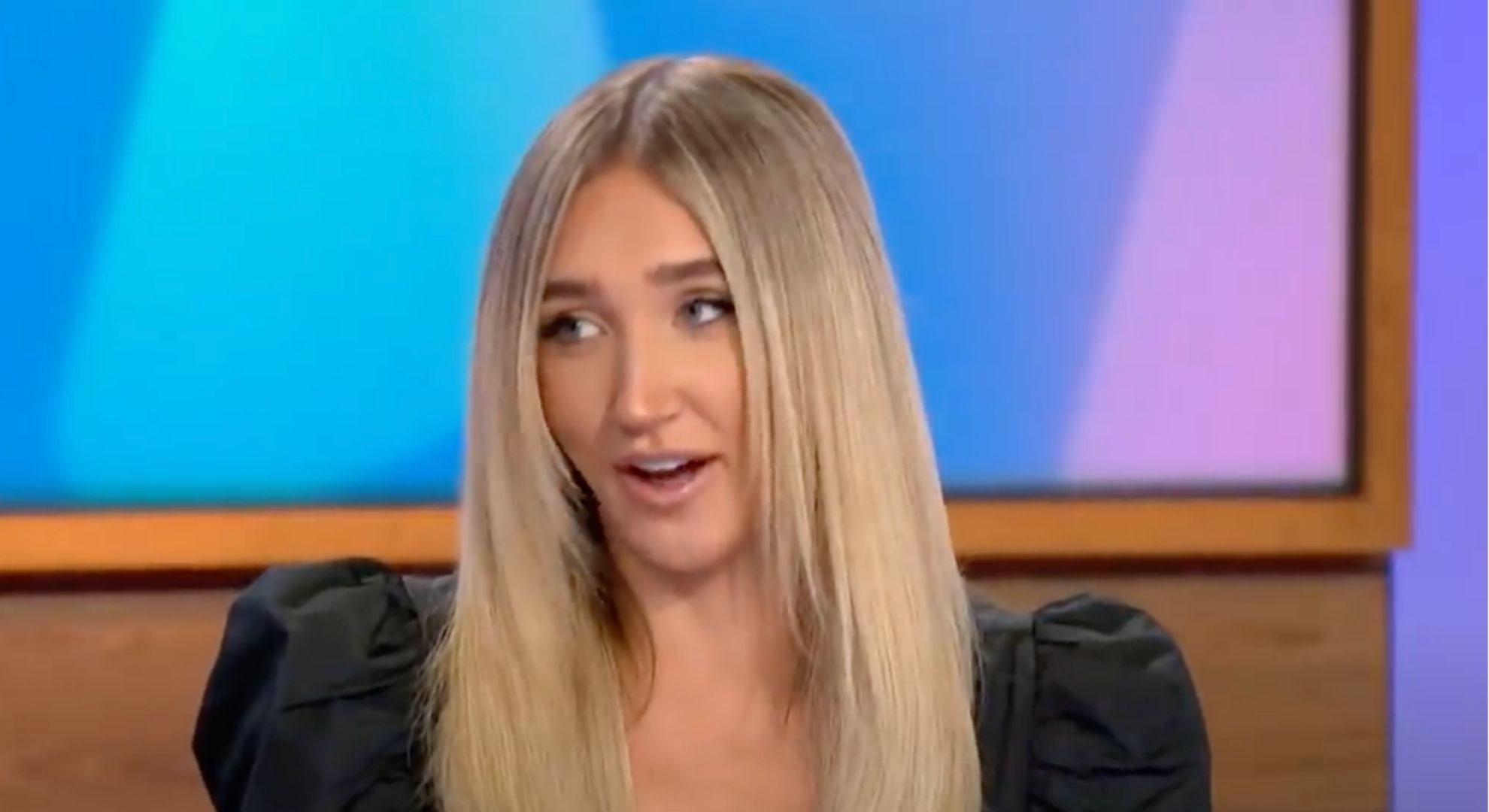 Megan McKenna wears a black blouse