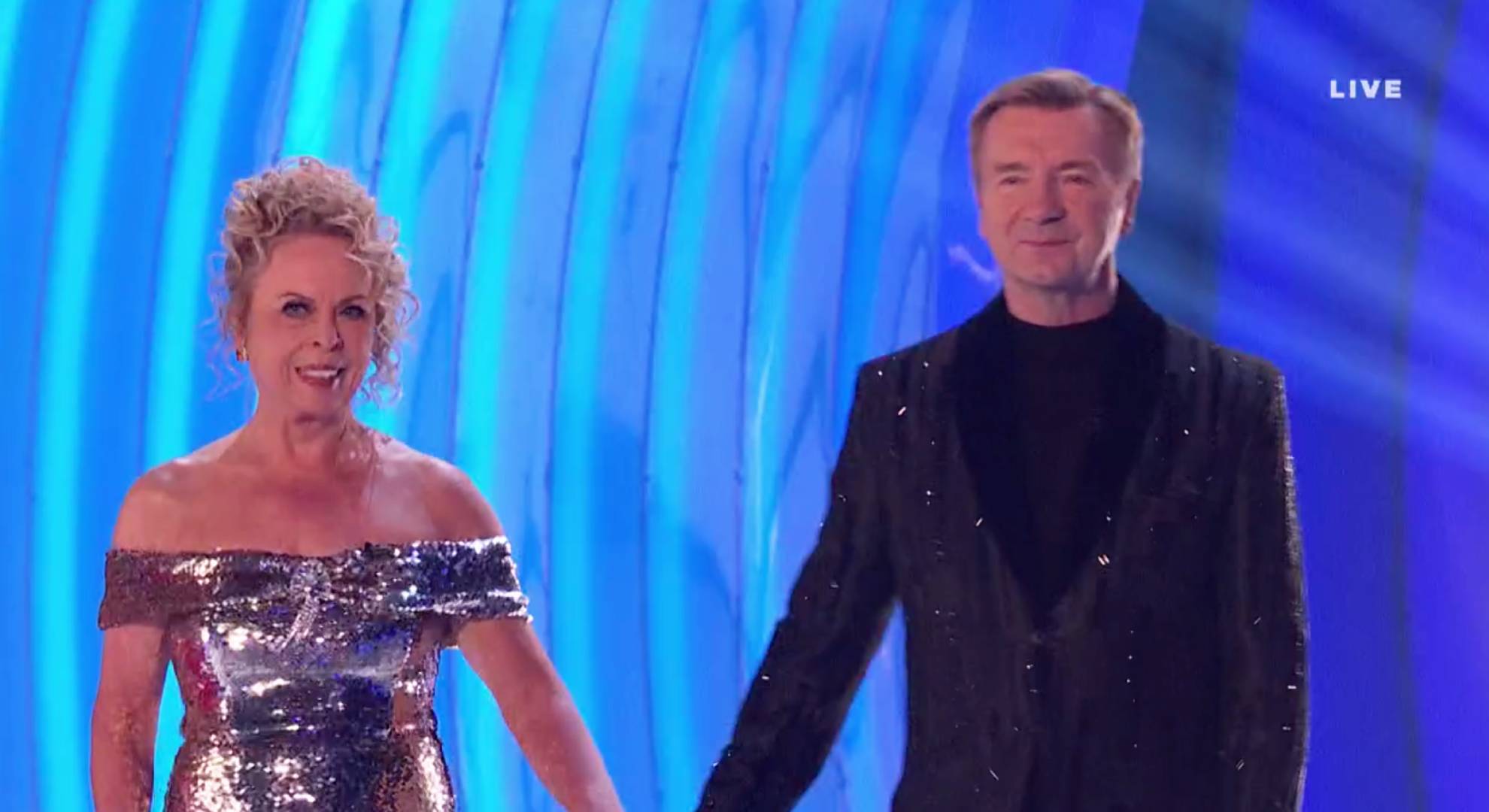 Jayne Torvill and Christopher Dean hold hands