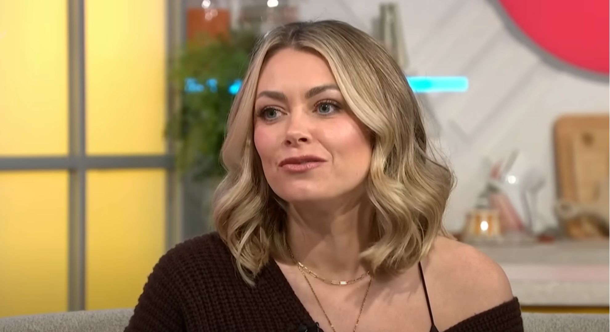 Georgia Jones wears a brown blouse