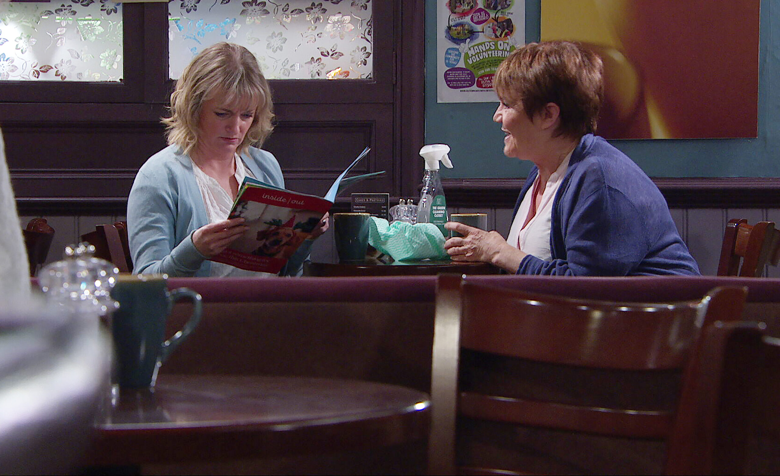 Nicola and Brenda reading a magazine