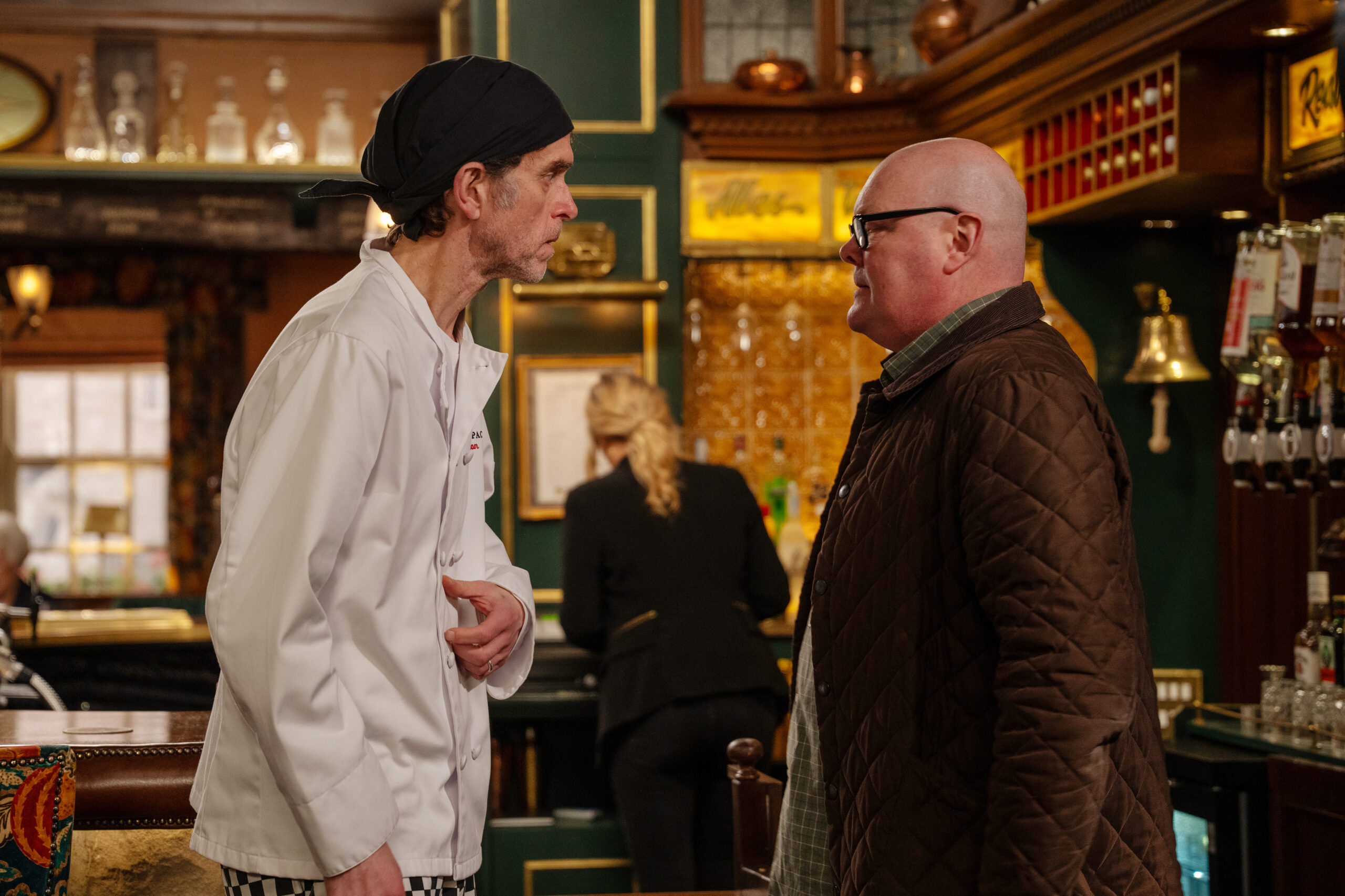 Marlon and Paddy having a tense conversation in the Woolpack