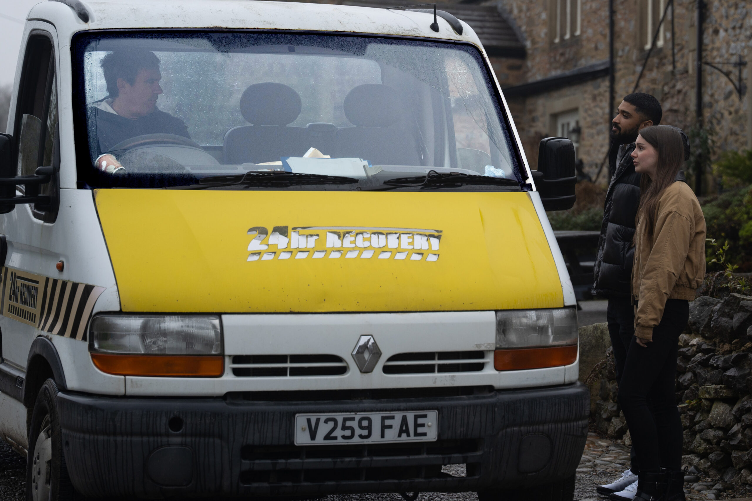 Kammy and Sarah talking to Cain who is driving a van