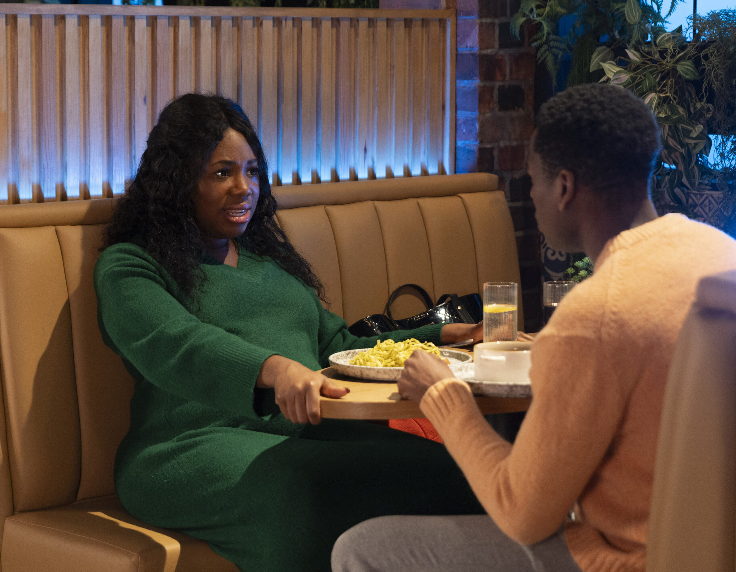 Dee-Dee and James talking over dinner