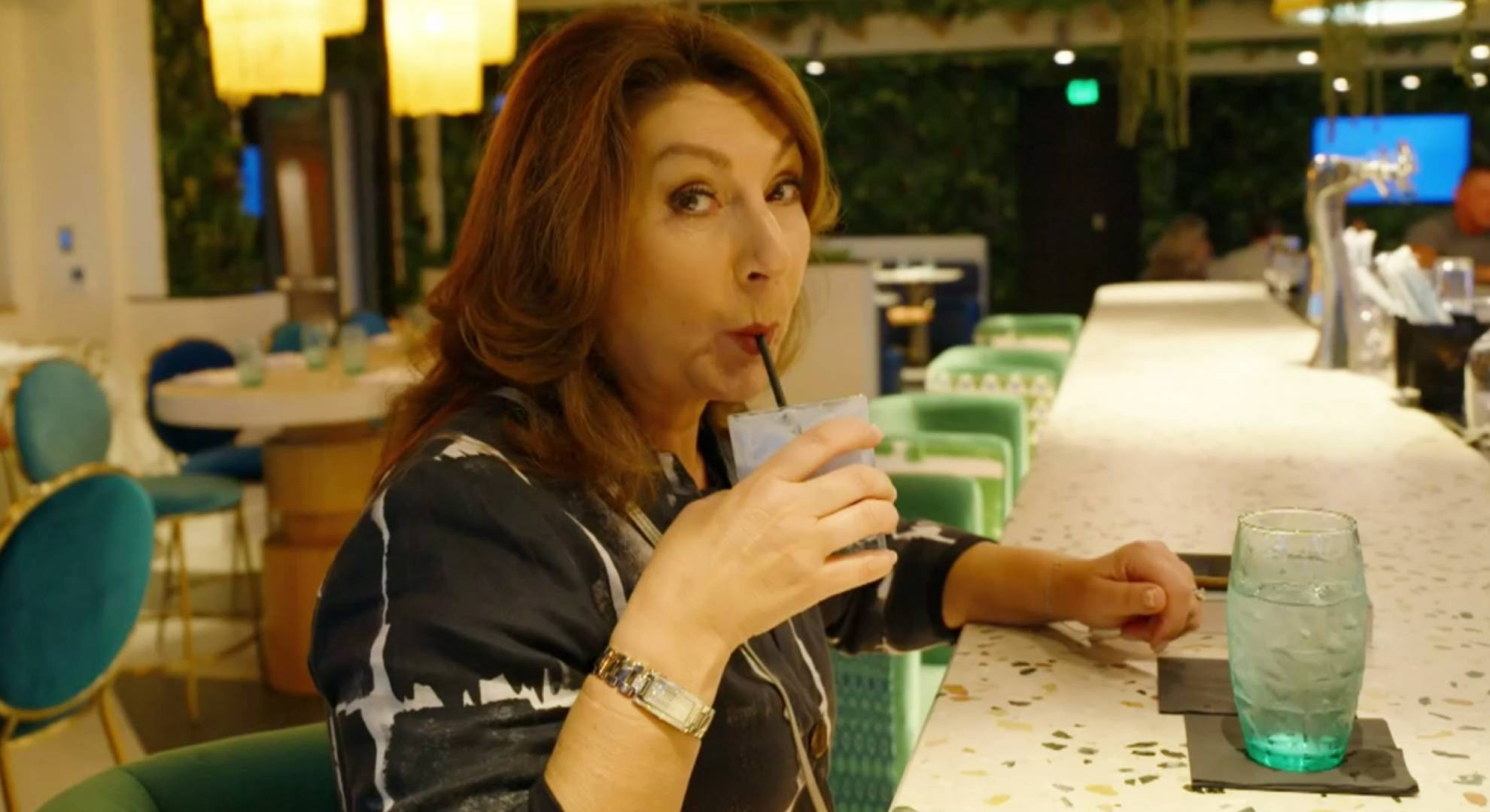 Jane McDonald uses a straw