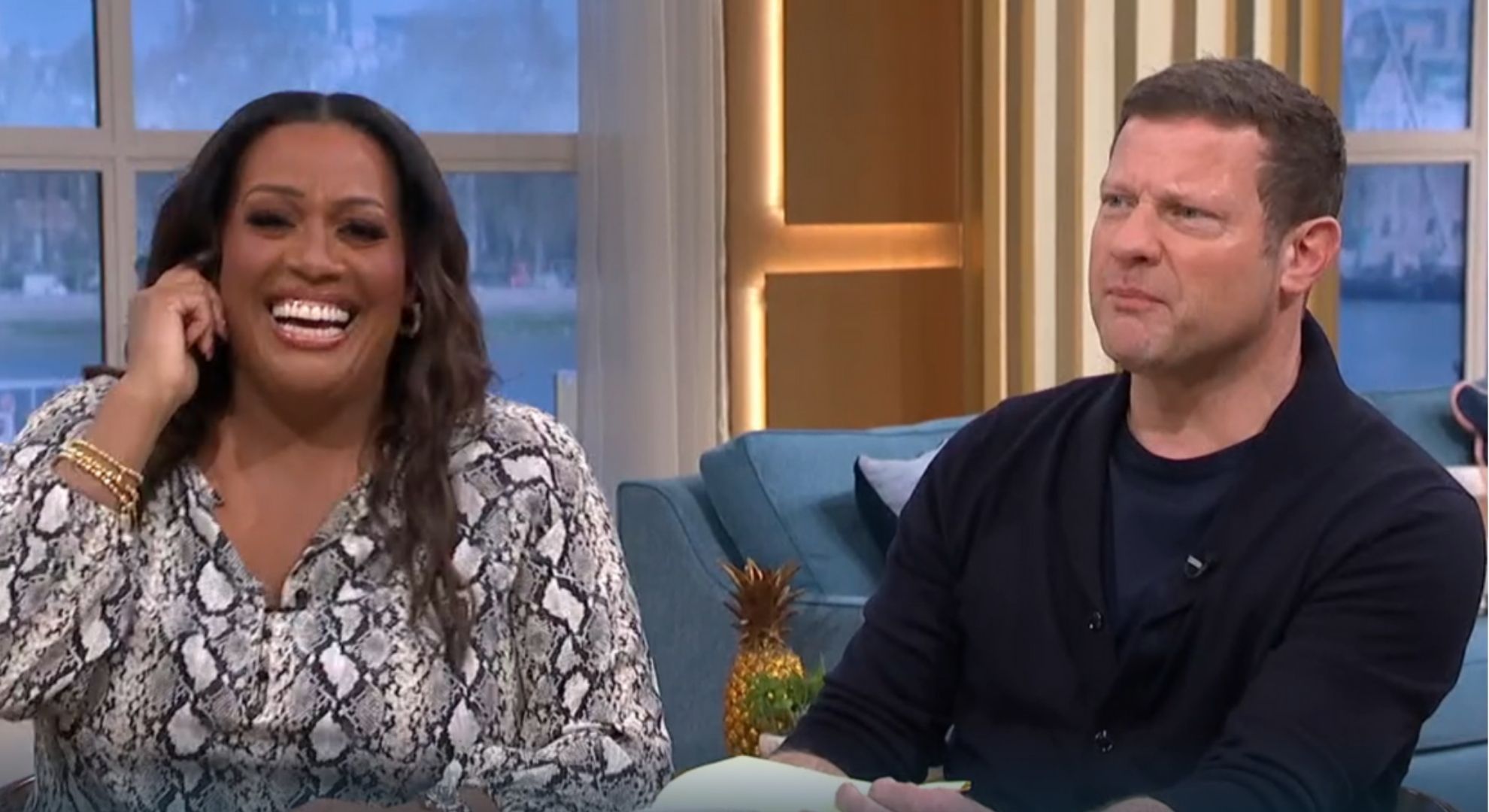 Alison Hammond laughing as Dermot O'Leary looks angry