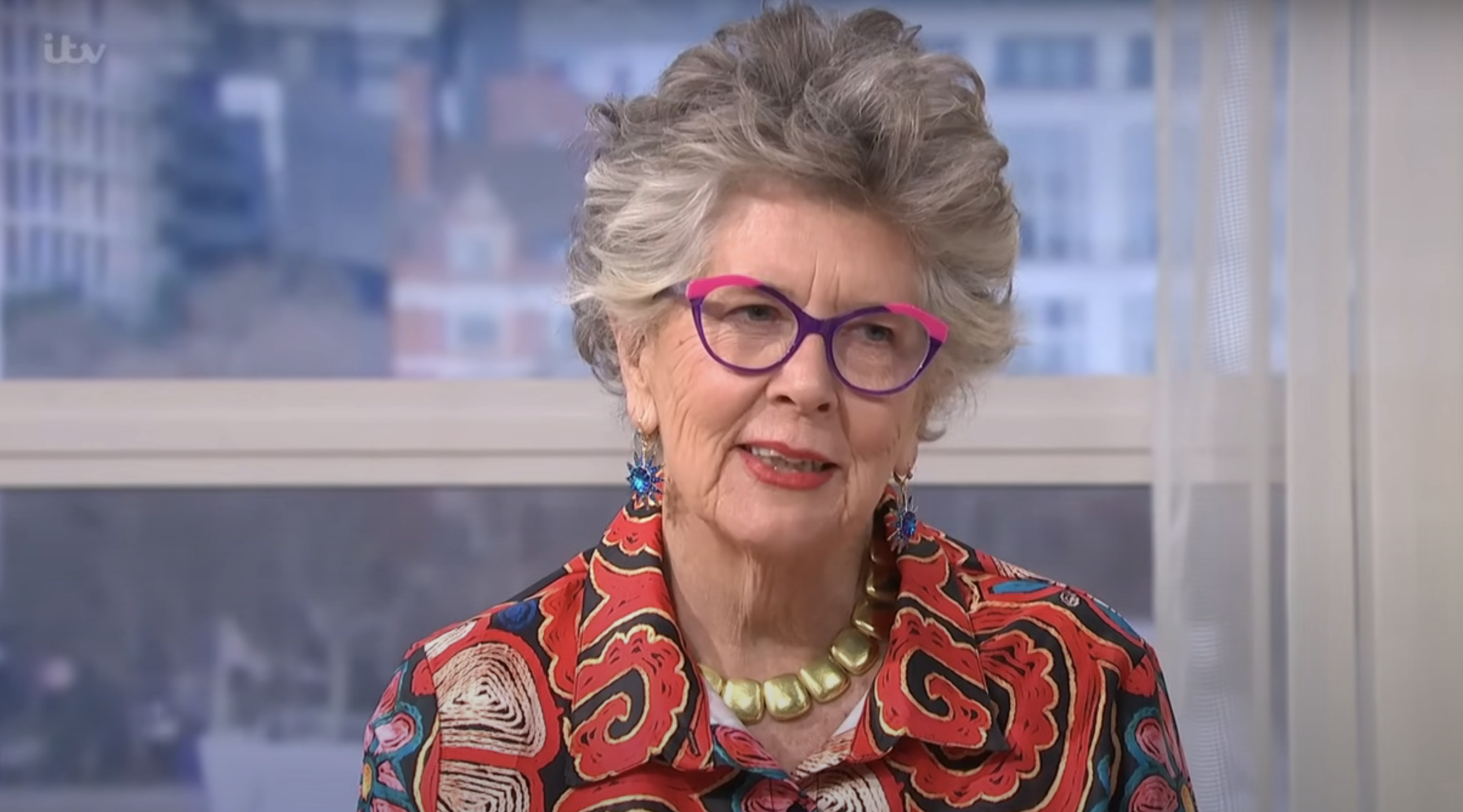 Prue Leith in a red floral top