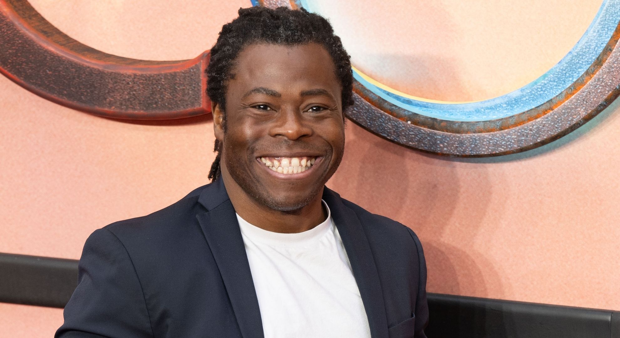 Ade Adepitan smiling