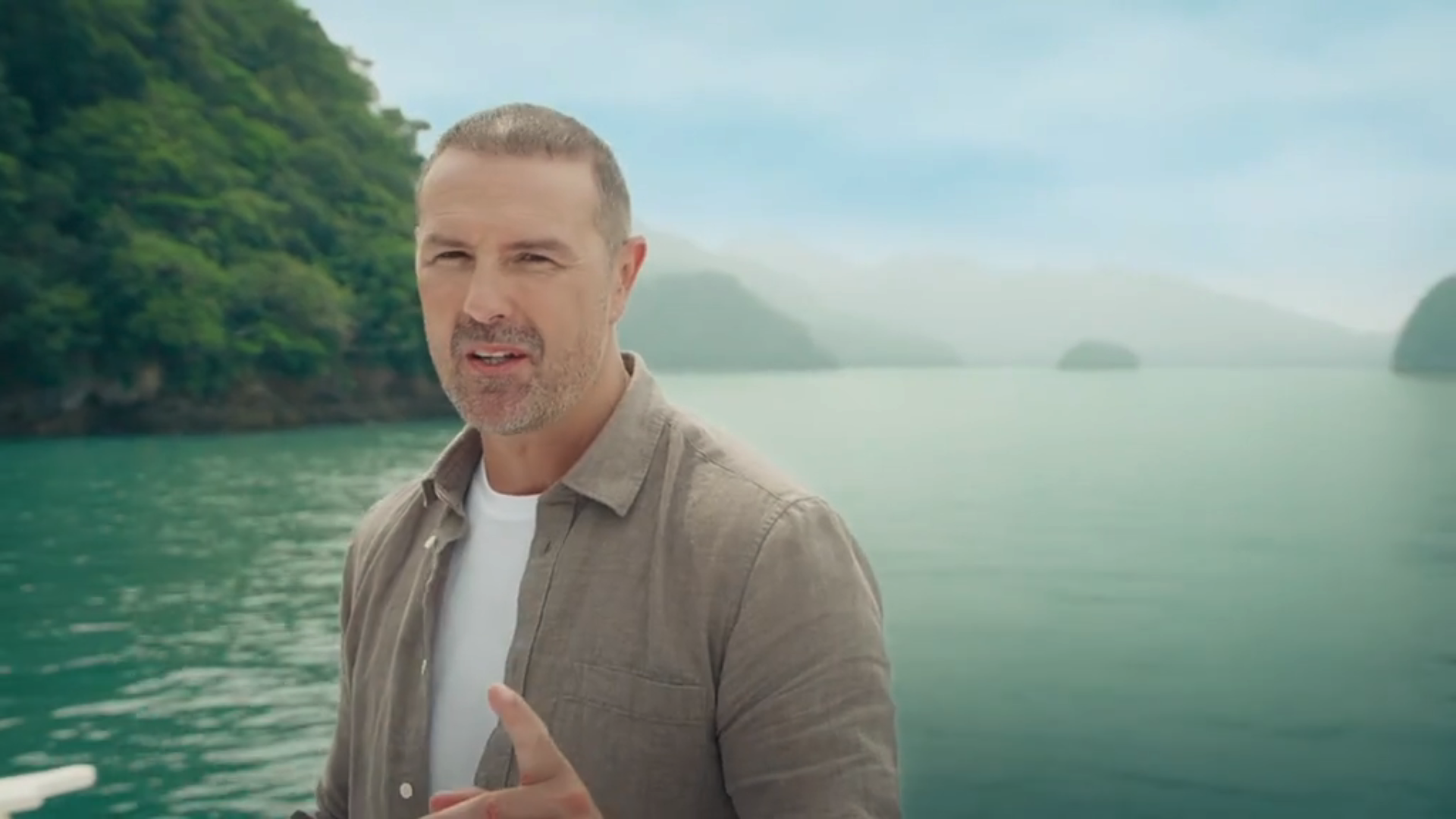 Paddy McGuinness walking on a beach