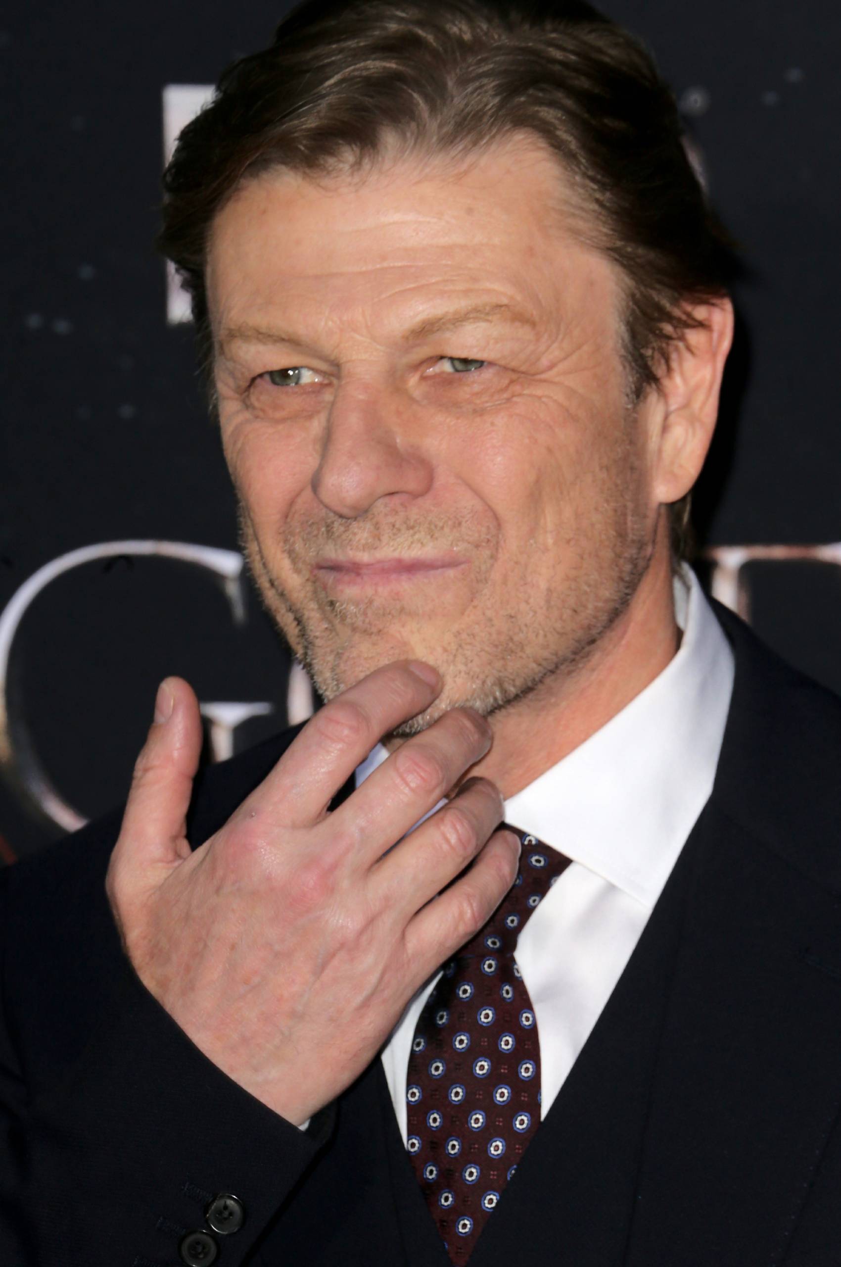 Sean Bean scratches his chin