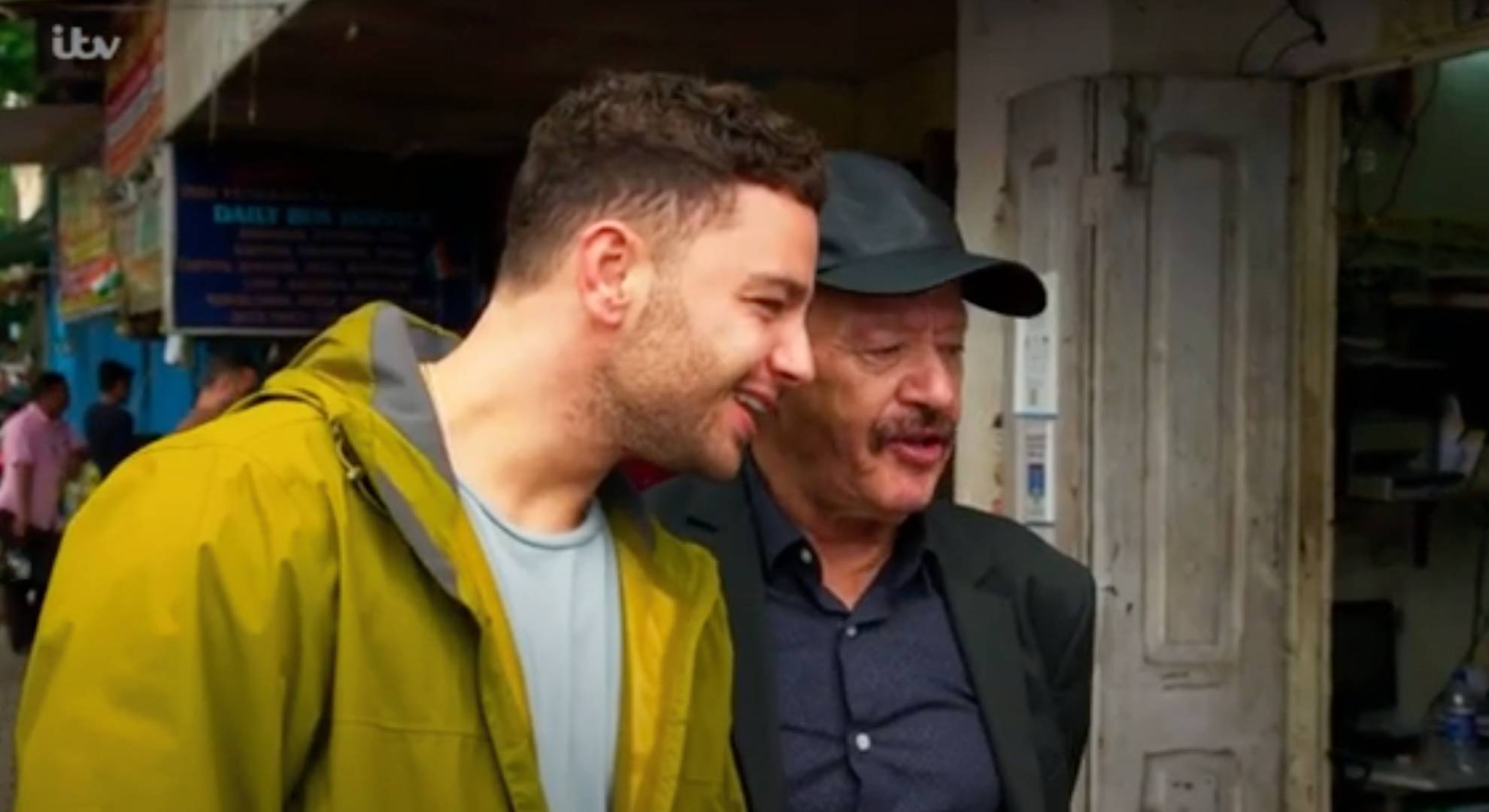 Adam Thomas peers with his dad Dougie