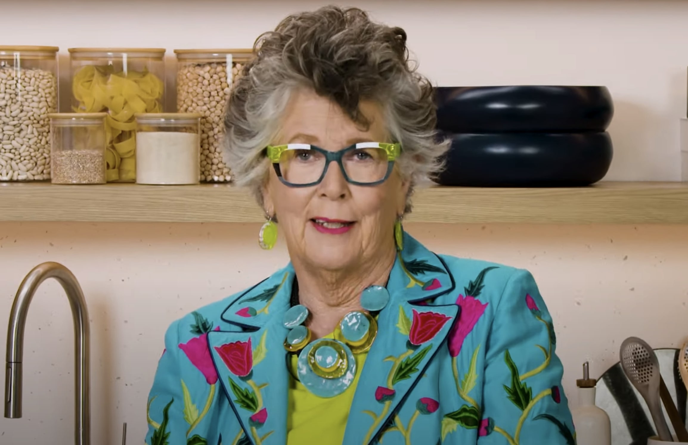 Prue Leith facing camera in a colourful suit